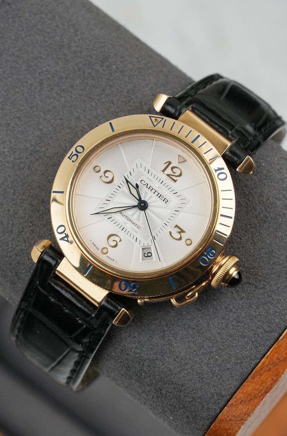 May be an image of wrist watch and text