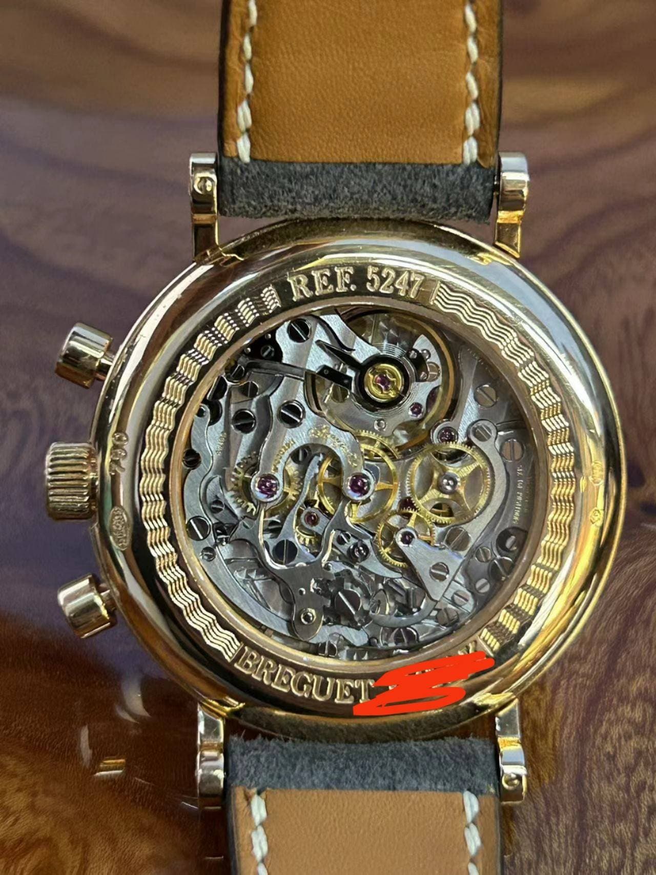 May be an image of wrist watch and text