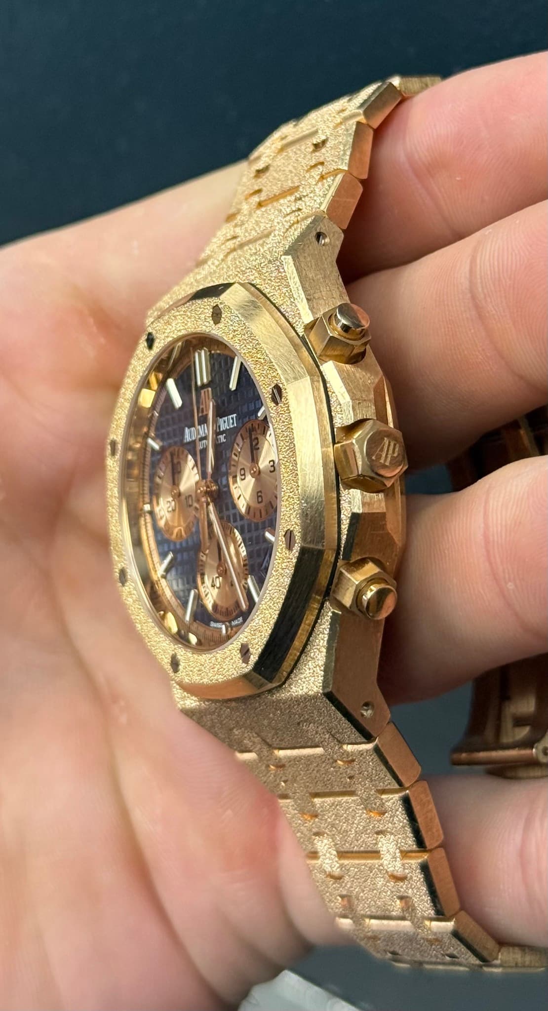 May be an image of wrist watch and text