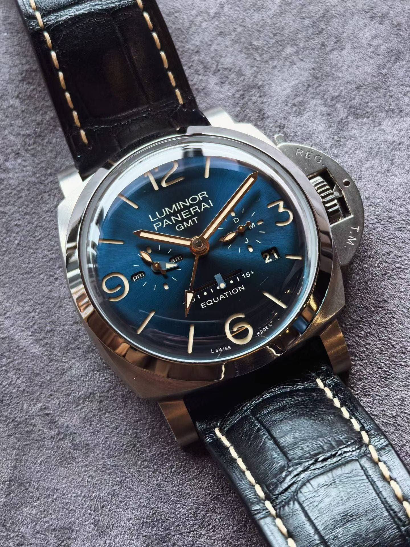 May be an image of wrist watch and text that says 'P LUMINOR LUMIEBAI PANERAI GMT REG Y ל nuin ποnη - T.M ว 4 9 pm 15+ EQUATION TION EQUA LSWISS 6 MADEL'