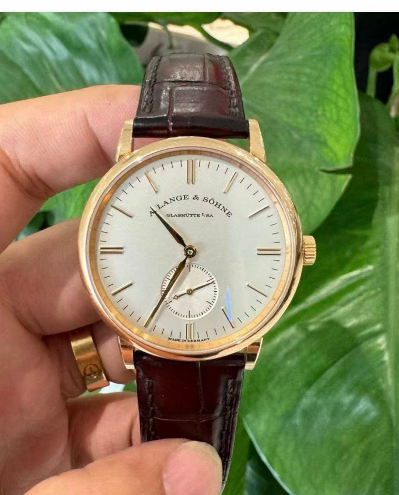 May be an image of wrist watch and text