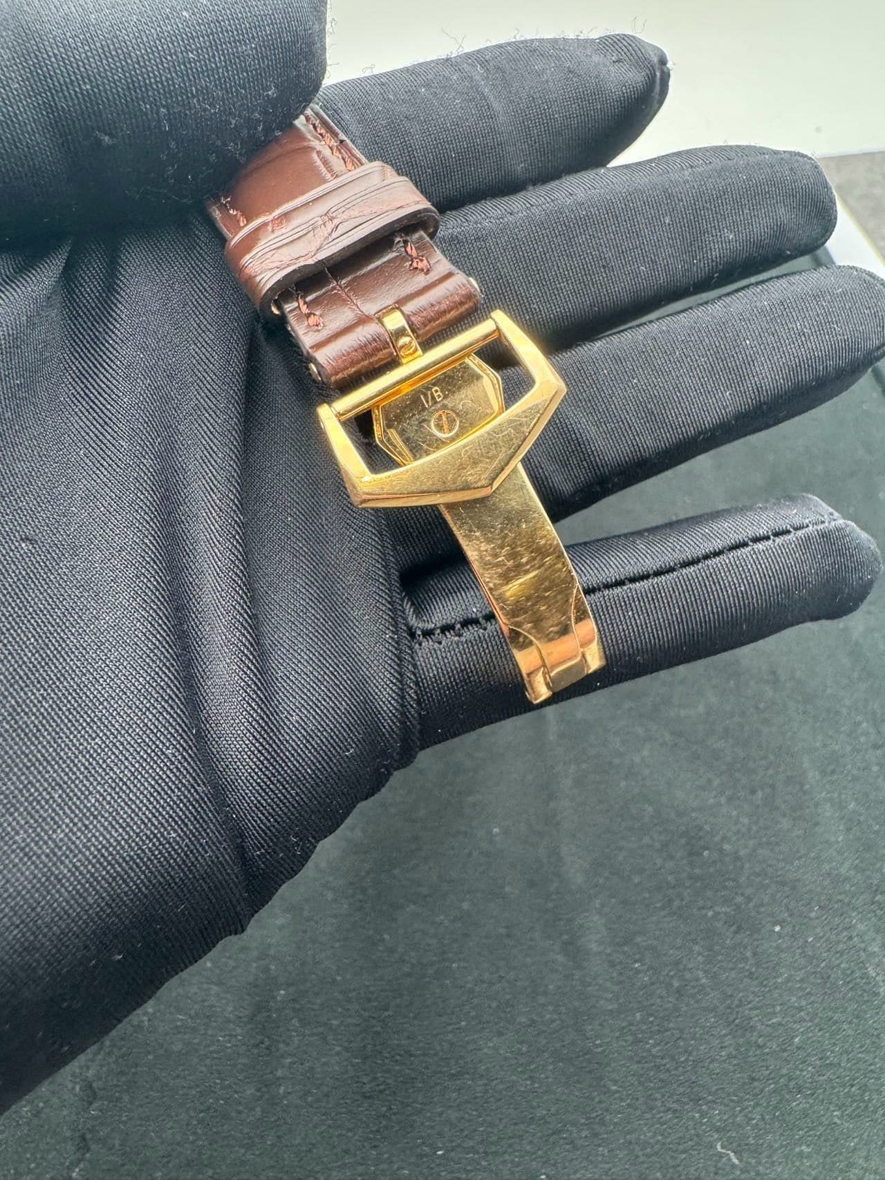 May be an image of wrist watch and leather
