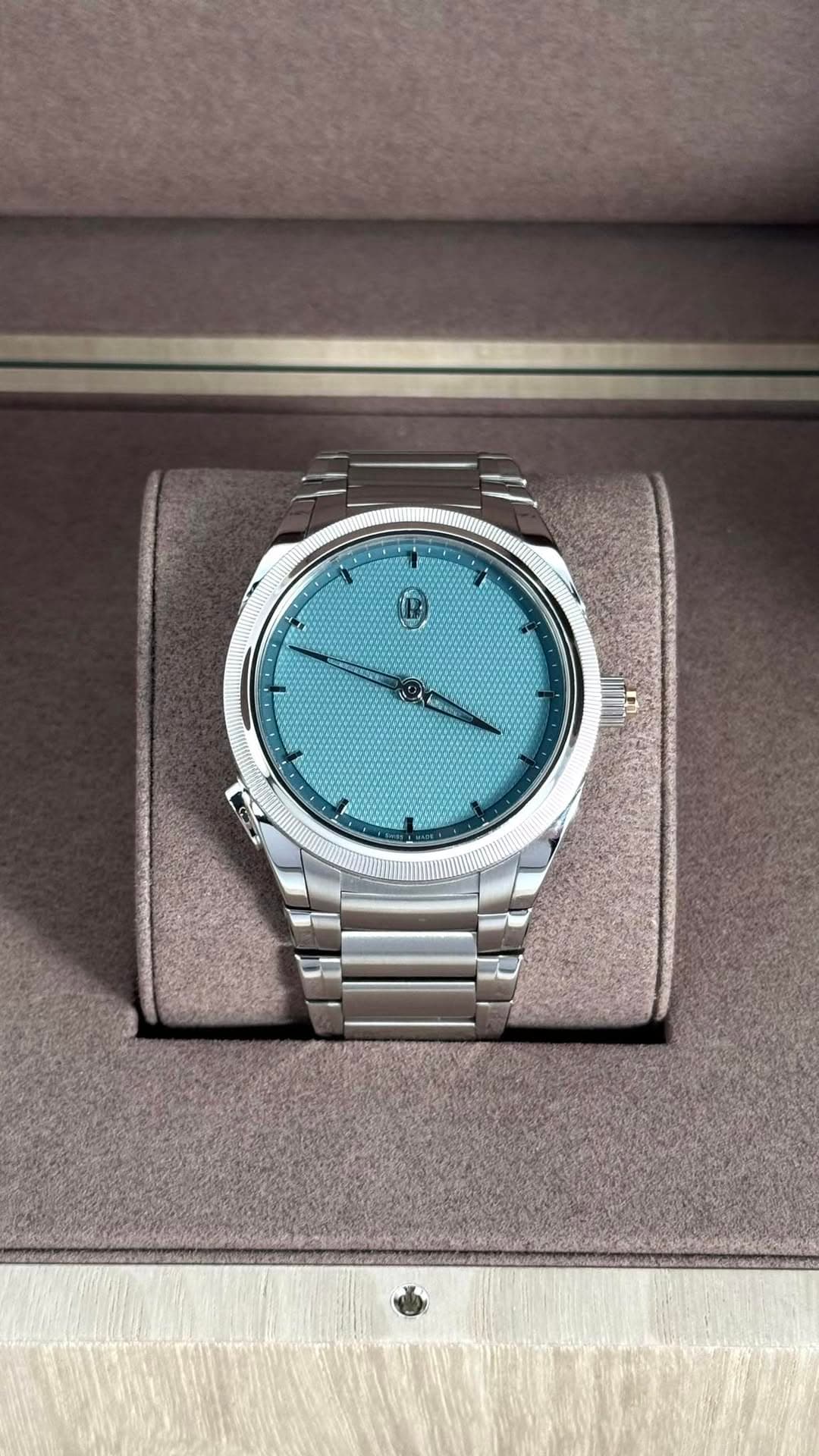 May be an image of wrist watch and text