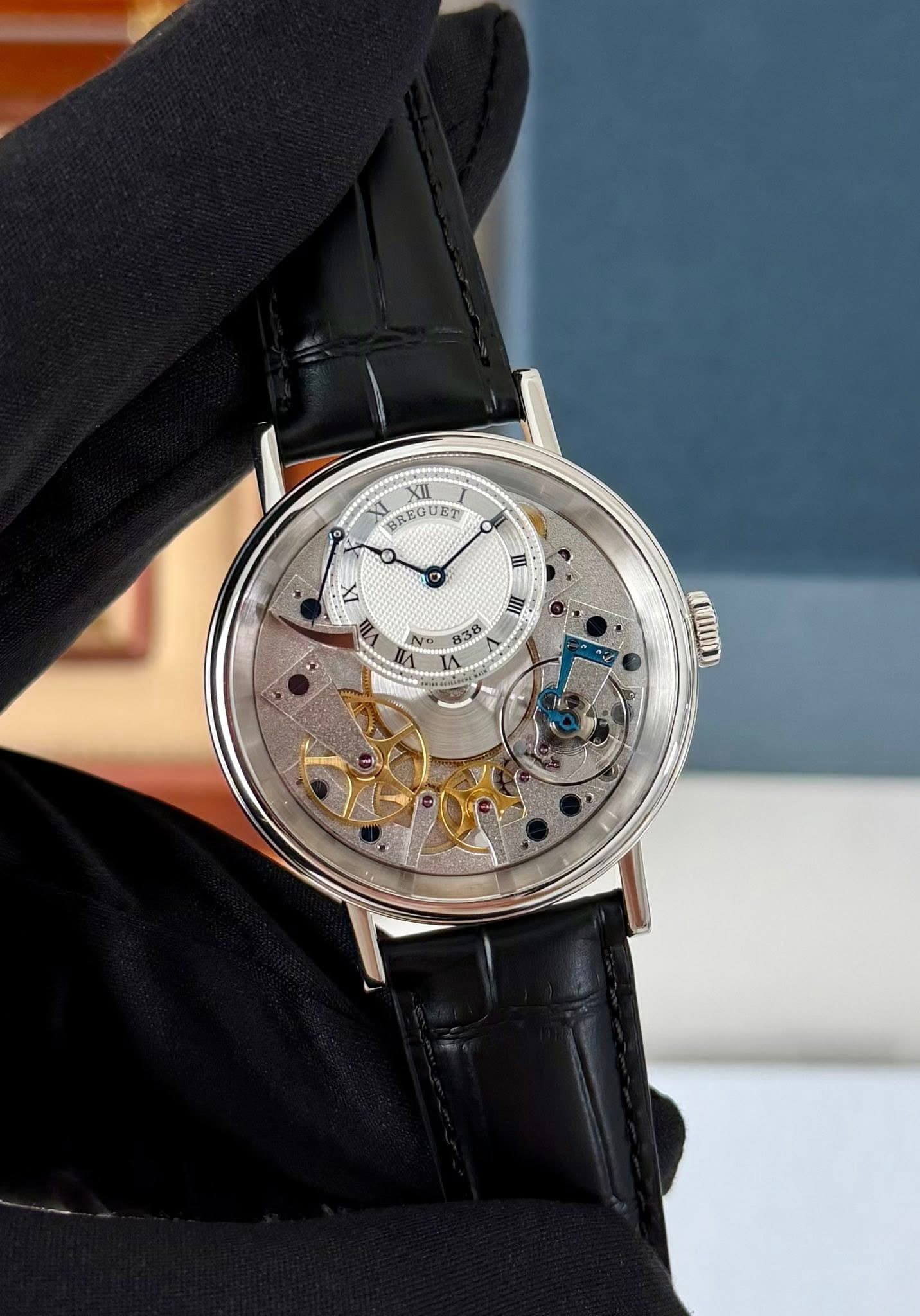May be an image of wrist watch and text that says 'XI BREGUET XII BREGUET Y I II 838 מש!'