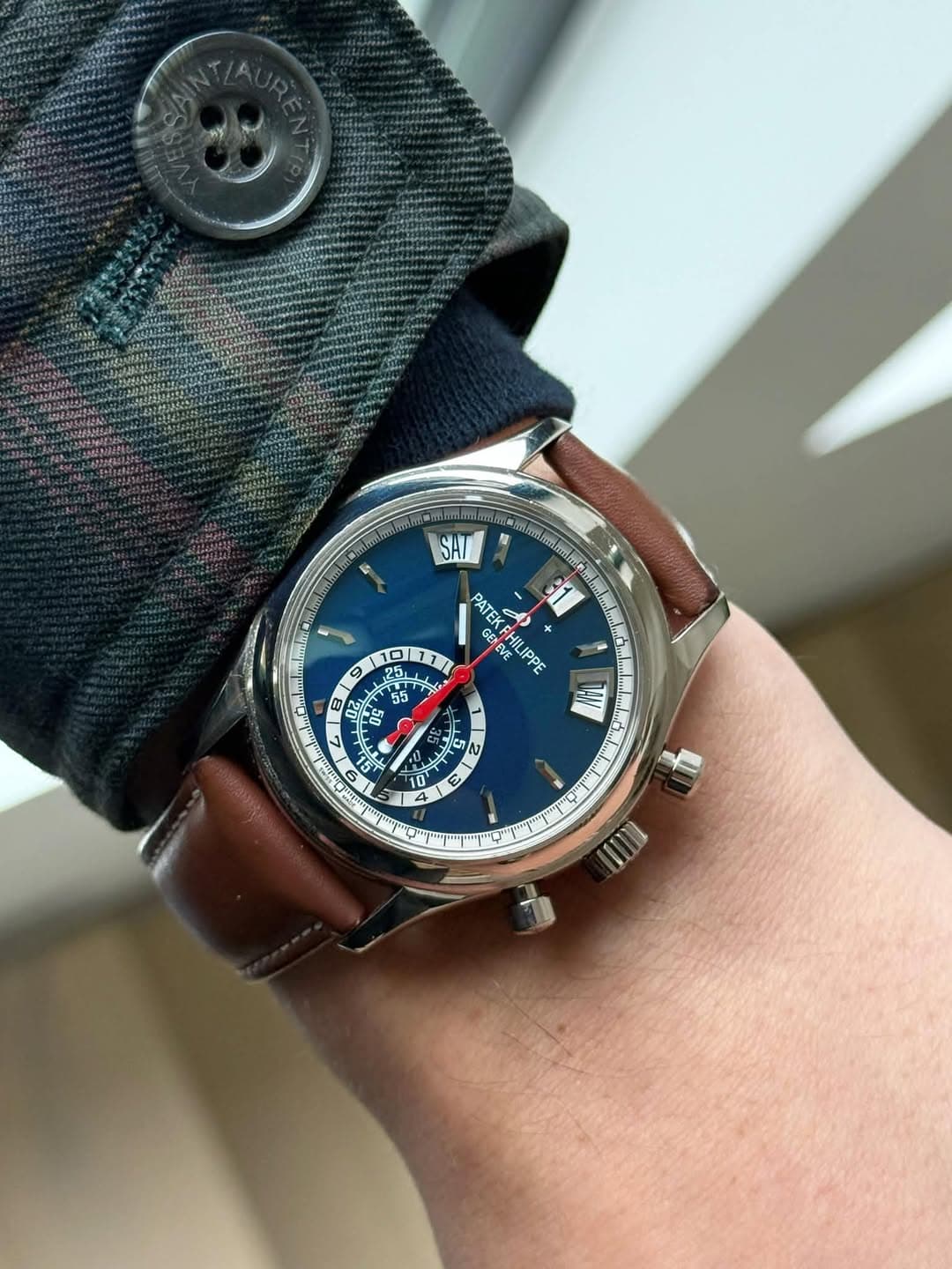 May be an image of wrist watch and text