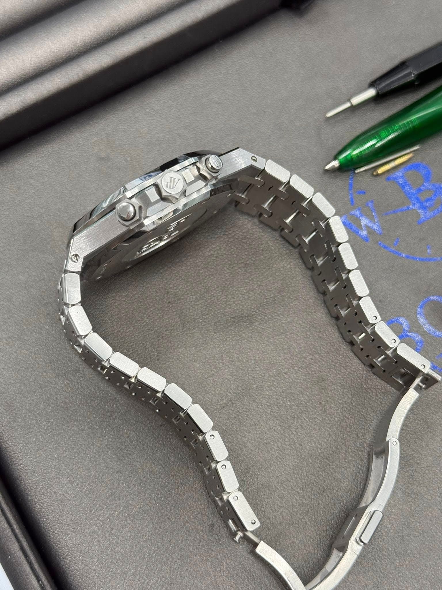 May be an image of digital watch, jewelry and text