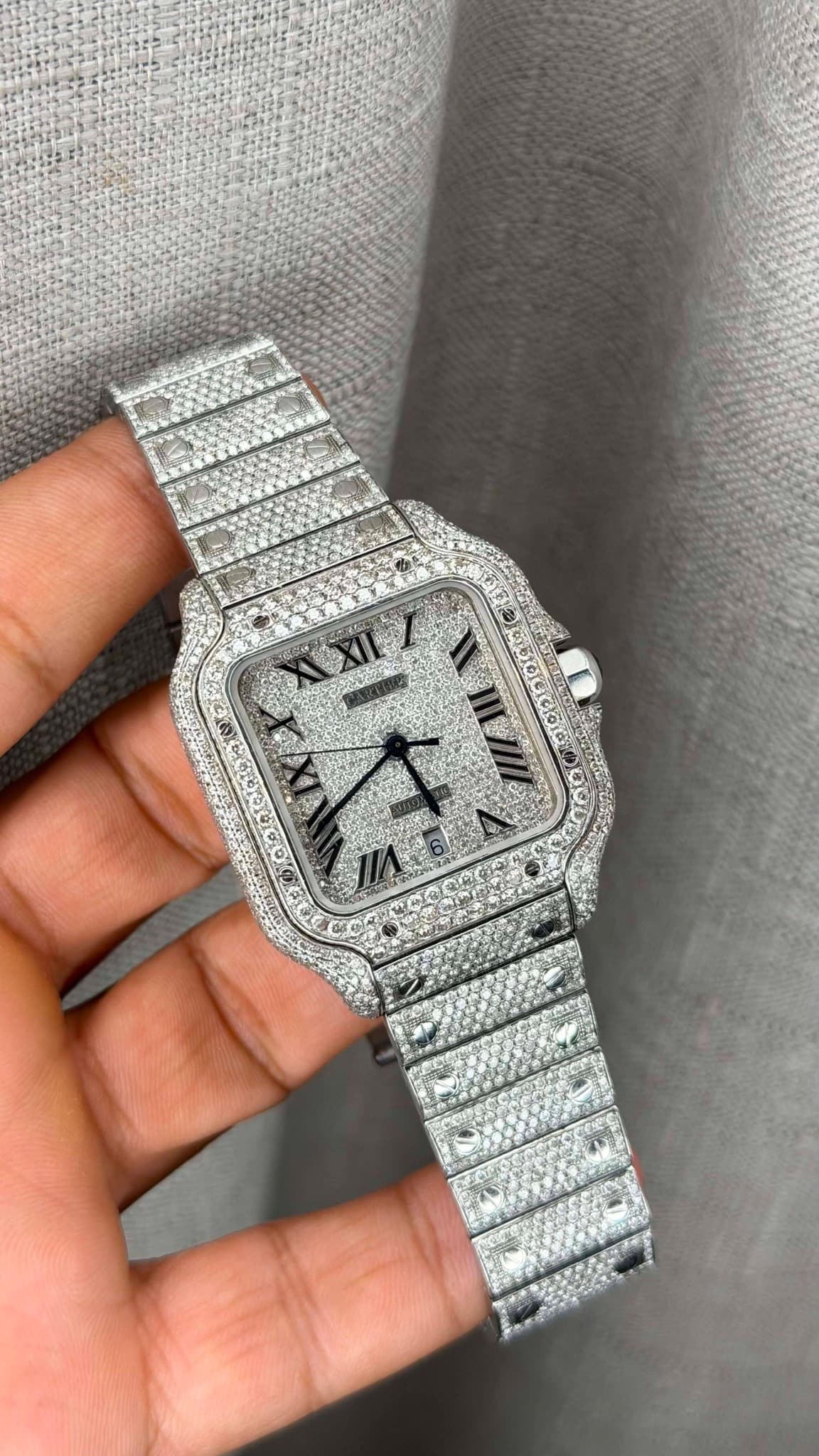 May be an image of wrist watch and text