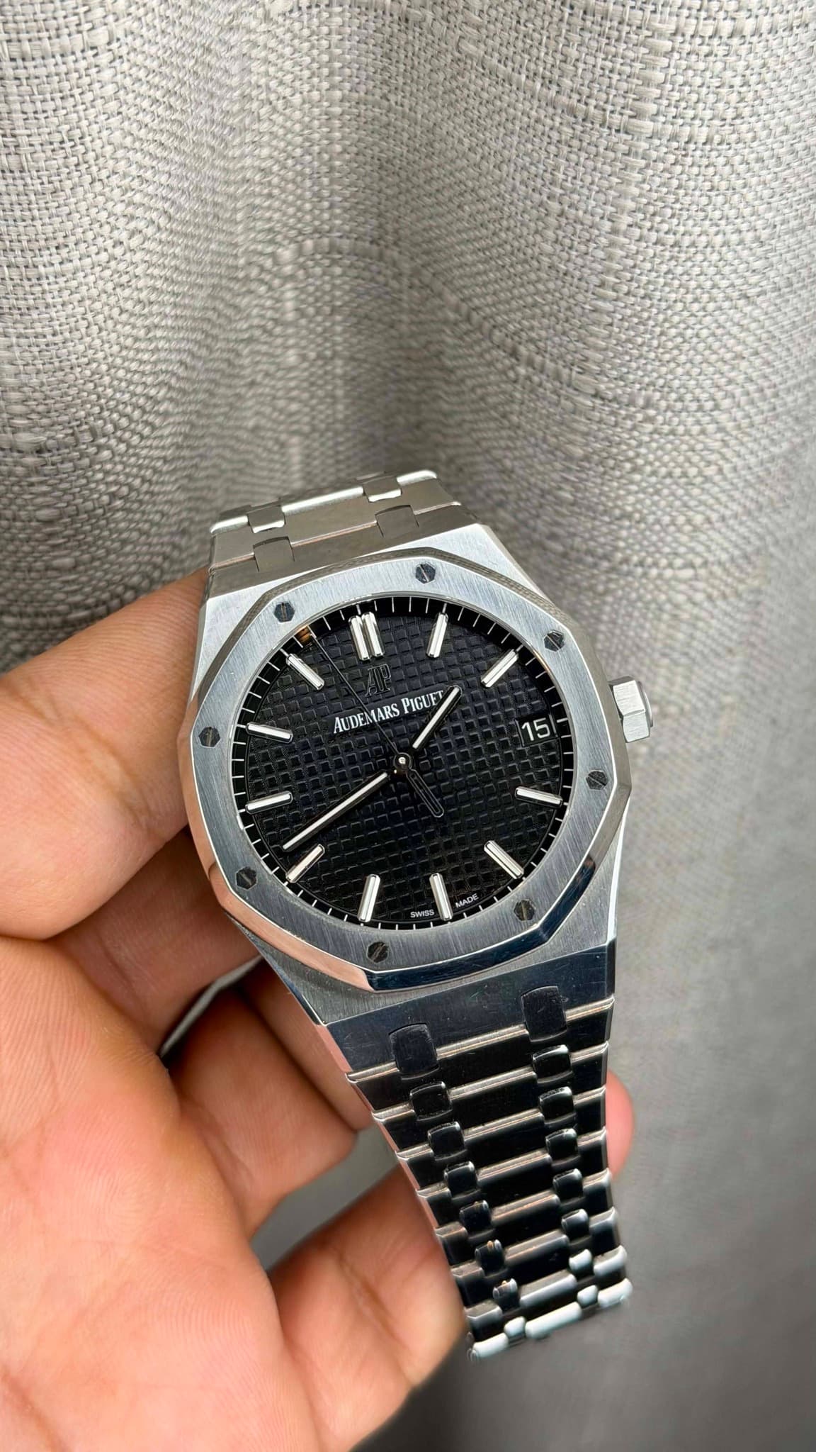 May be an image of wrist watch and text