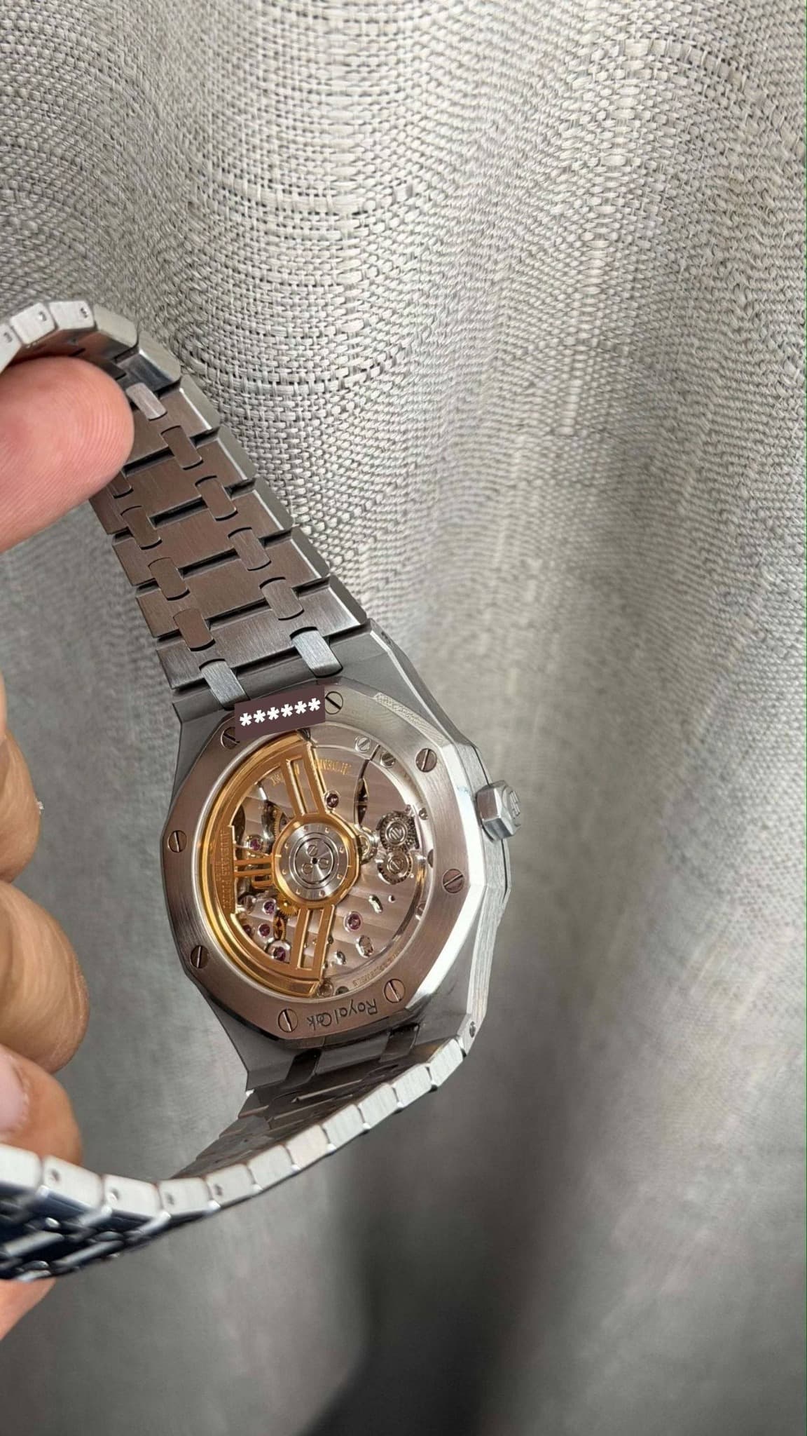 May be an image of wrist watch and text