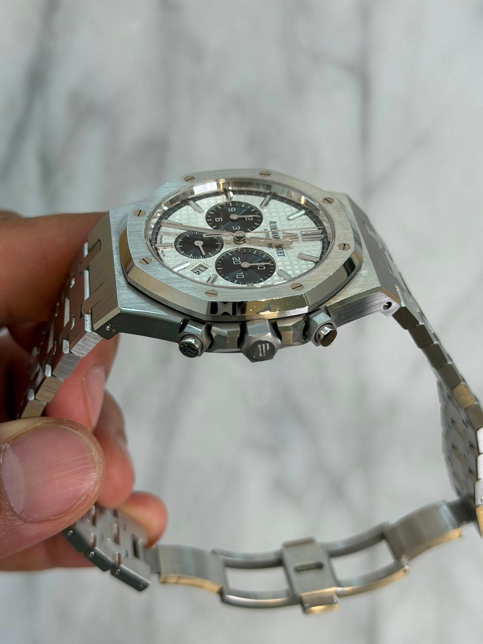 May be an image of wrist watch and text