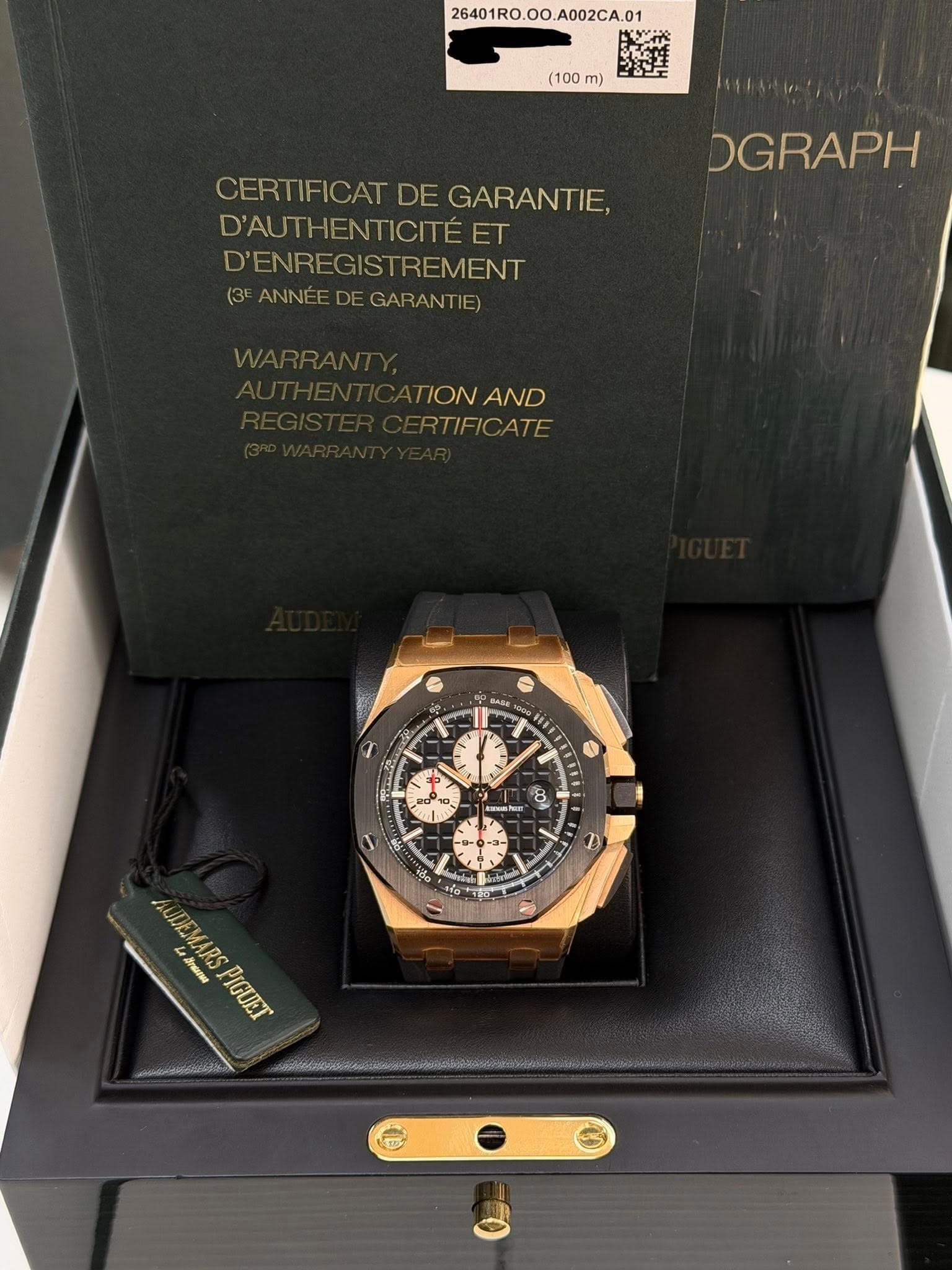 May be an image of wrist watch and text that says '26401R0. 26401R0.00.A002CA.01 A002CA.01 (100 m) CERTIFICAT DE GARANTIE, D'AUTHENTICITÉET D'ENREGISTREMENT STREMENT (3E ANNE…