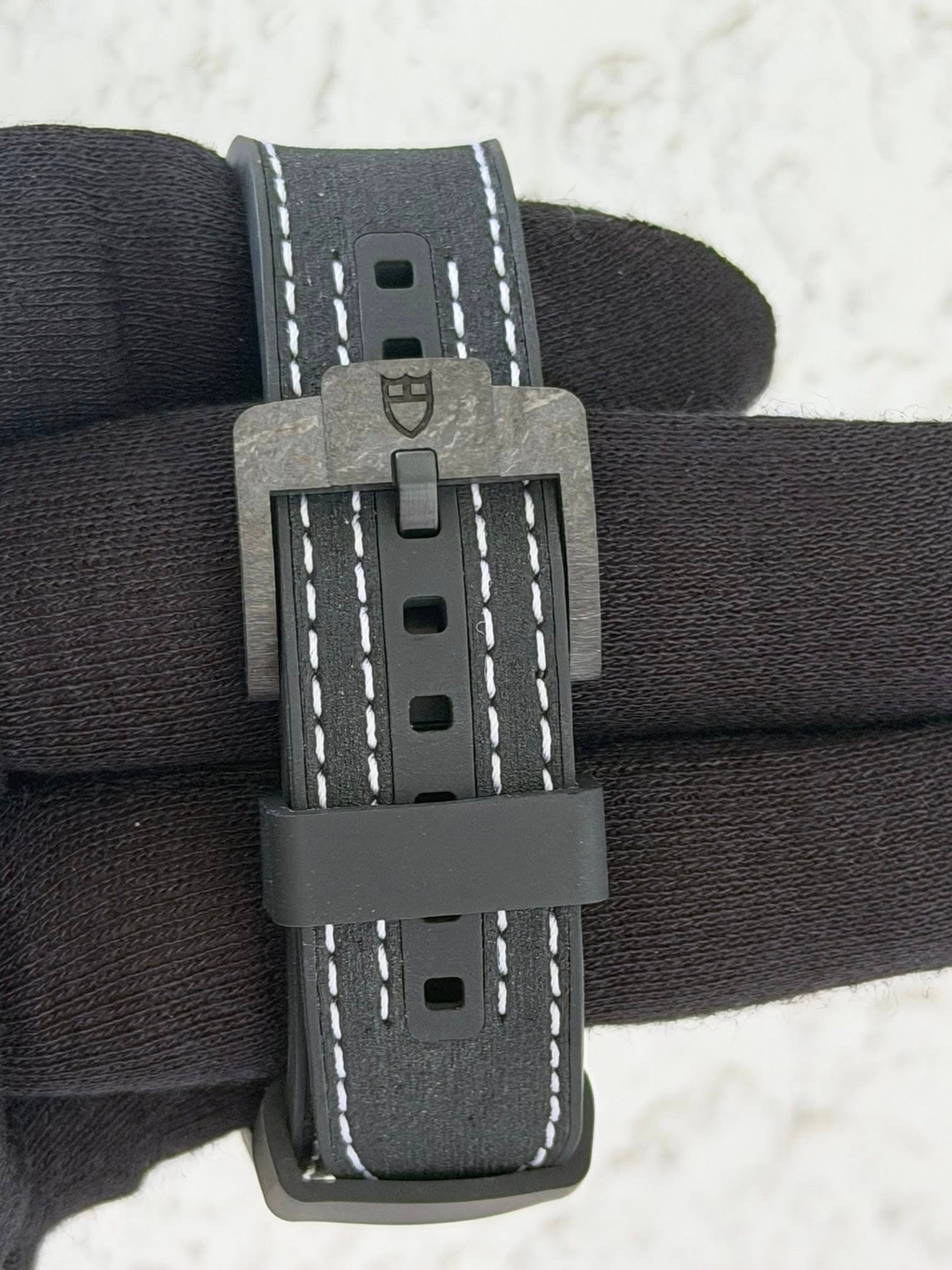 May be an image of leather, saddle-stitched leather and wrist watch