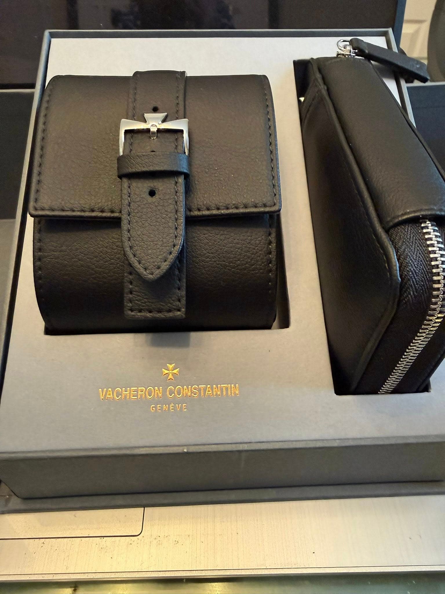 May be an image of saddle-stitched leather, leather wallet, leather and text that says 'VACHERON VACHERONCONSTANTIN CONSTANTIN GENEVE'