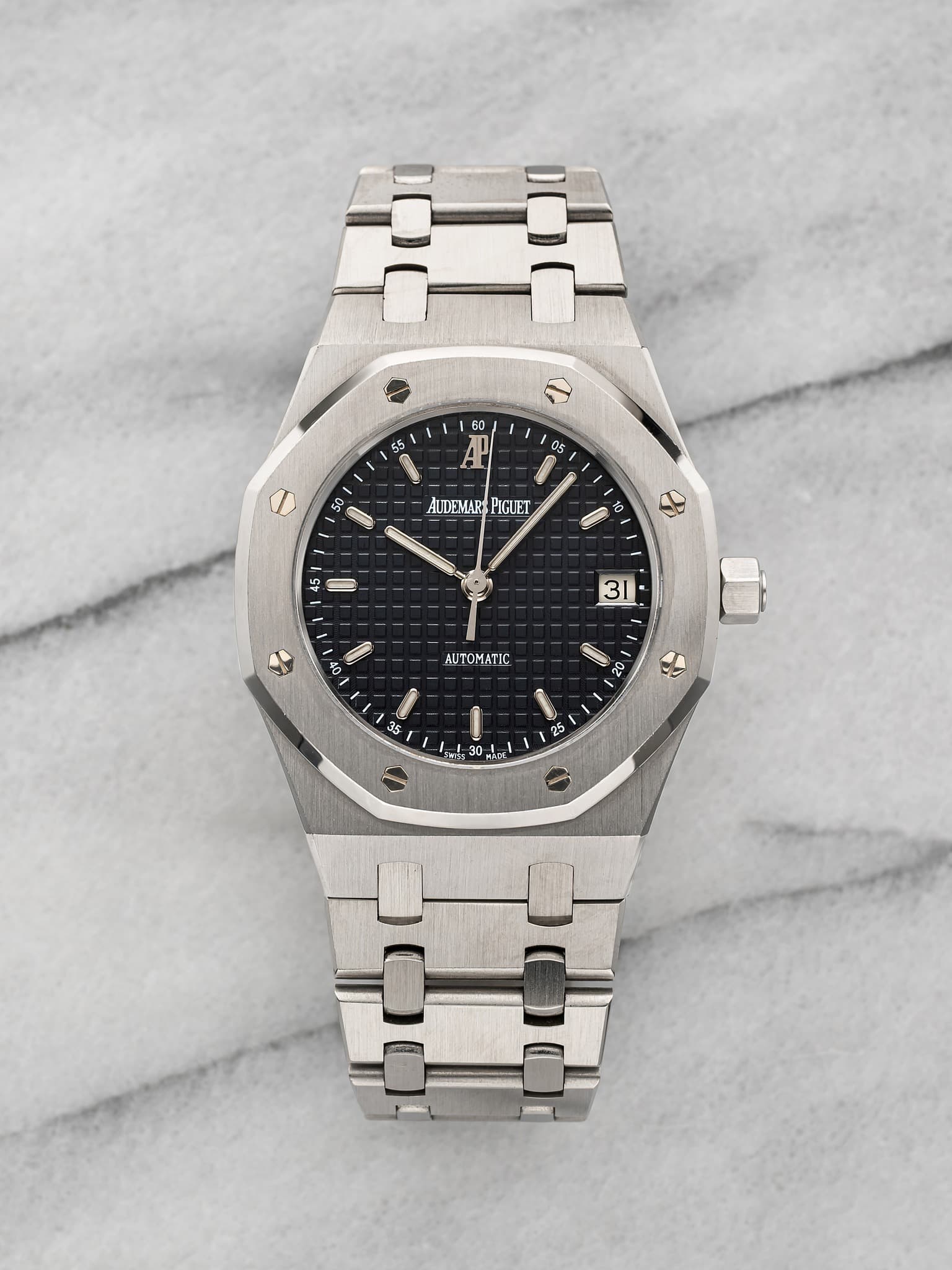 May be an image of wrist watch and text that says '60 55 4 H 05 O AUDEMAR PIGUET I 10 10 ا ΑυΤΟ 35 เป 20 ANTR sY ا'