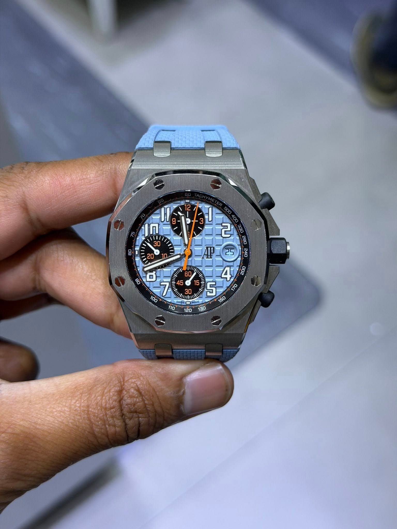 May be an image of wrist watch and text