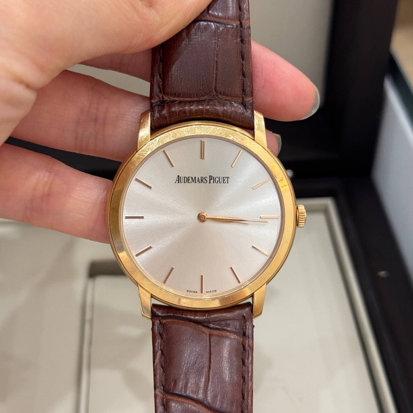 May be an image of wrist watch and text