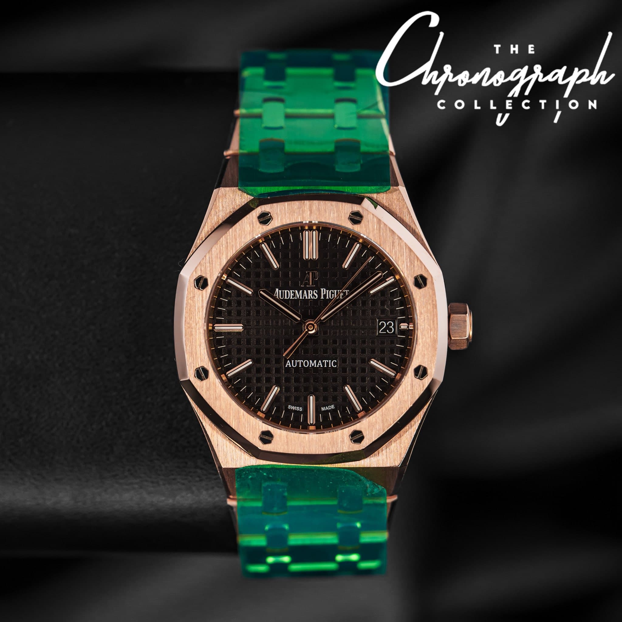 May be an image of wrist watch and text that says 'Ahjanszjaph E T THE T COLLECTION HI l' AUDEMARS PIGUZ 23 4 TIC Ses UDA'