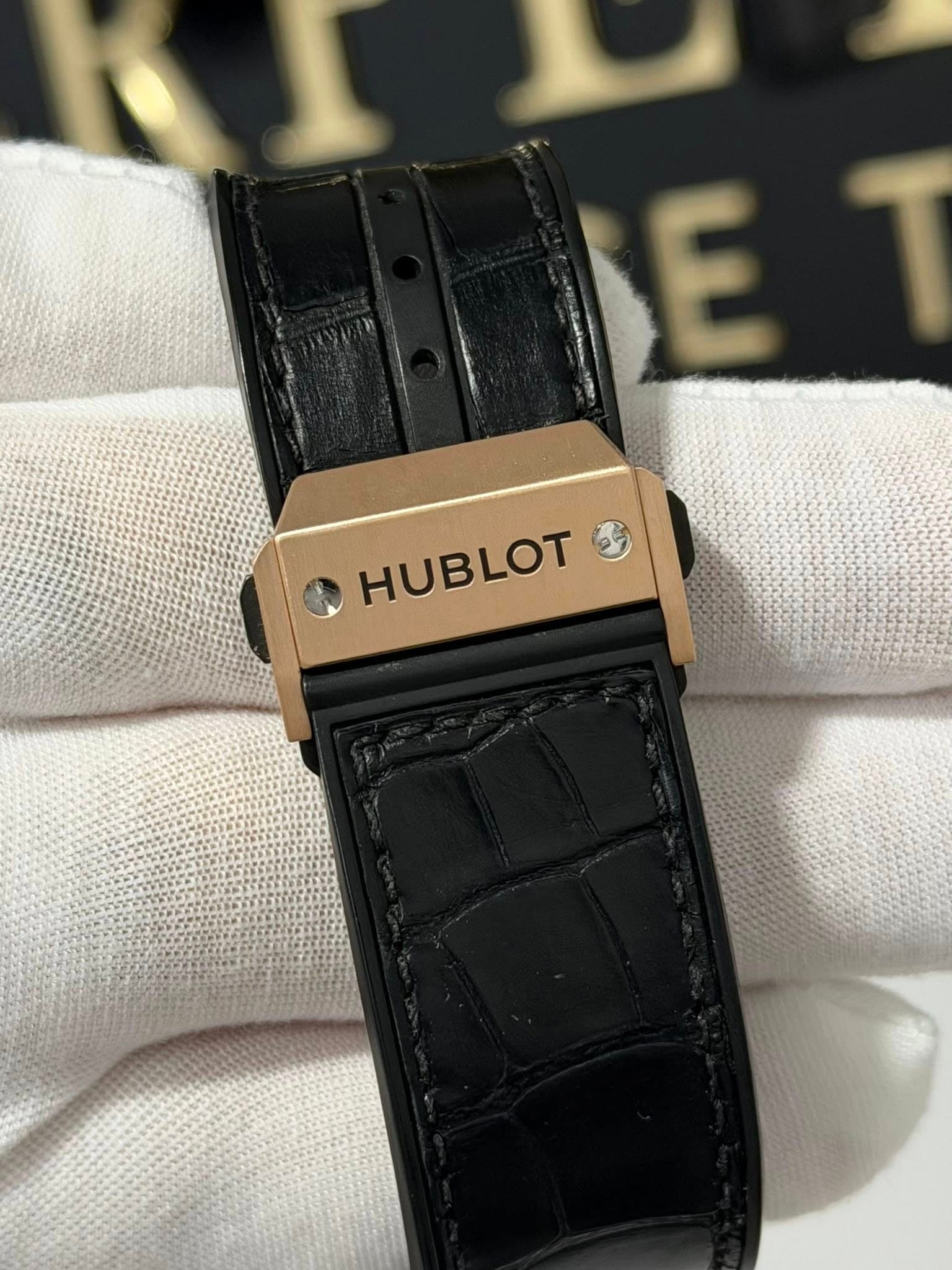 May be an image of wrist watch and text that says 'E E HUBLOT'