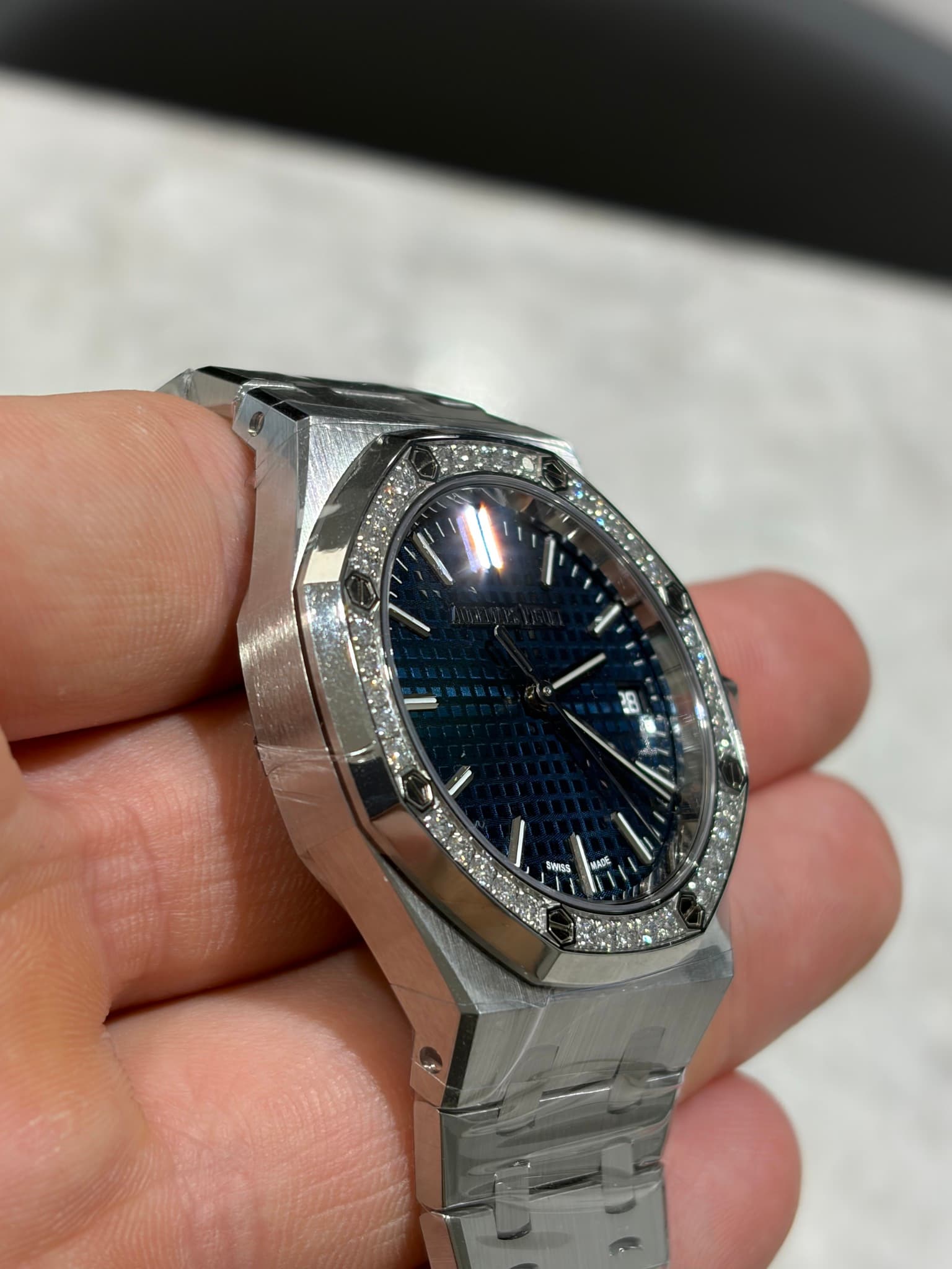 May be an image of wrist watch and text