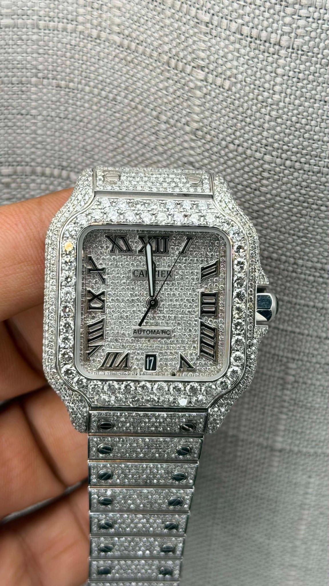 May be an image of wrist watch and text