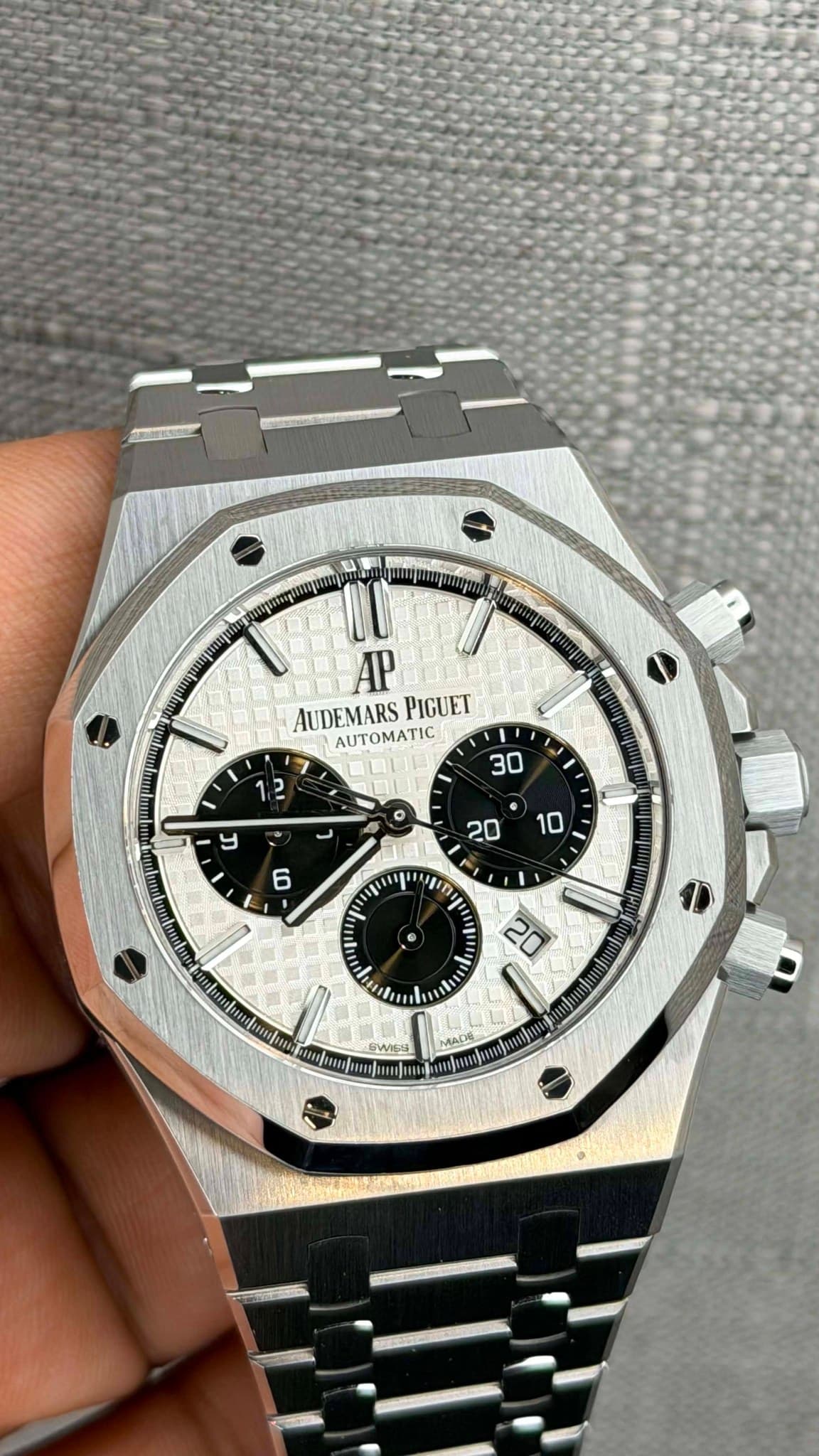 May be an image of wrist watch and text