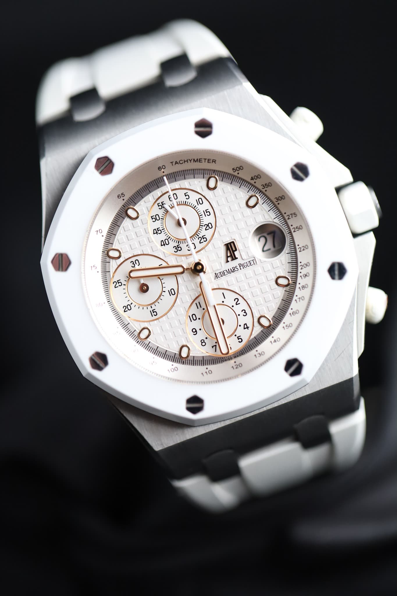 May be an image of wrist watch and text that says '60 TACHYMETER !!ረ " AO gi 35 275 ဟ س PGVVETI UDEMARS م '