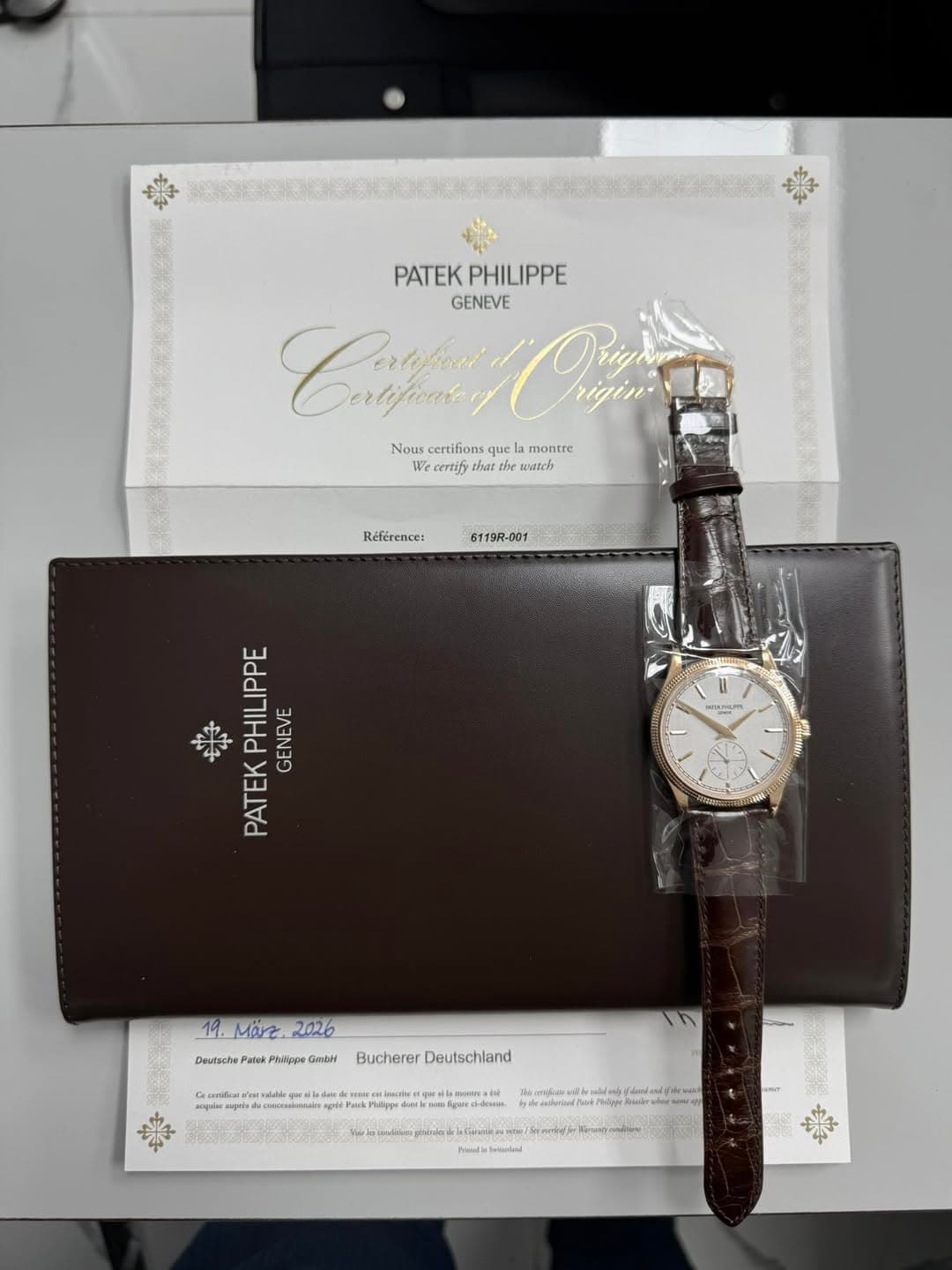May be an image of wrist watch and text