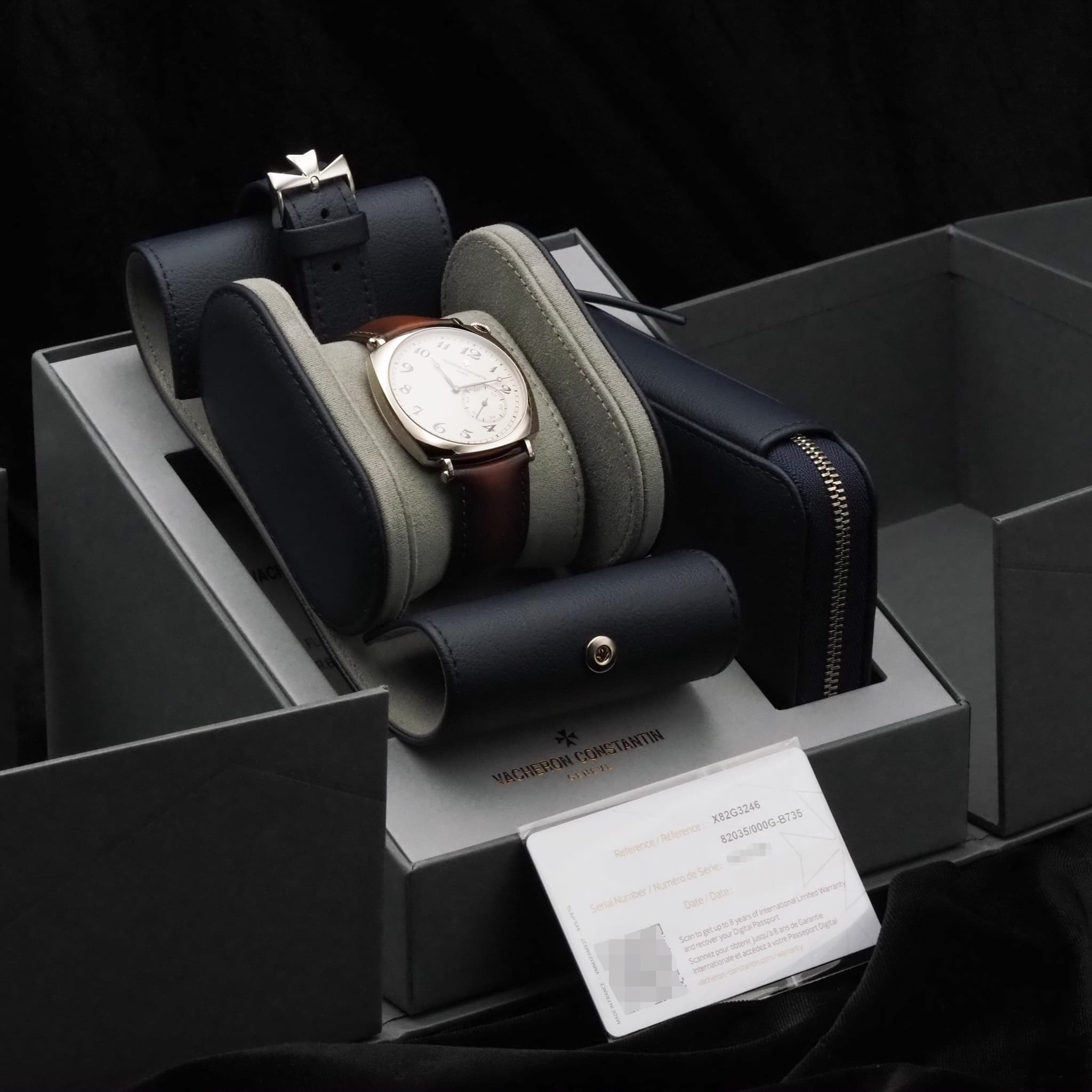 May be an image of leather, wrist watch and text