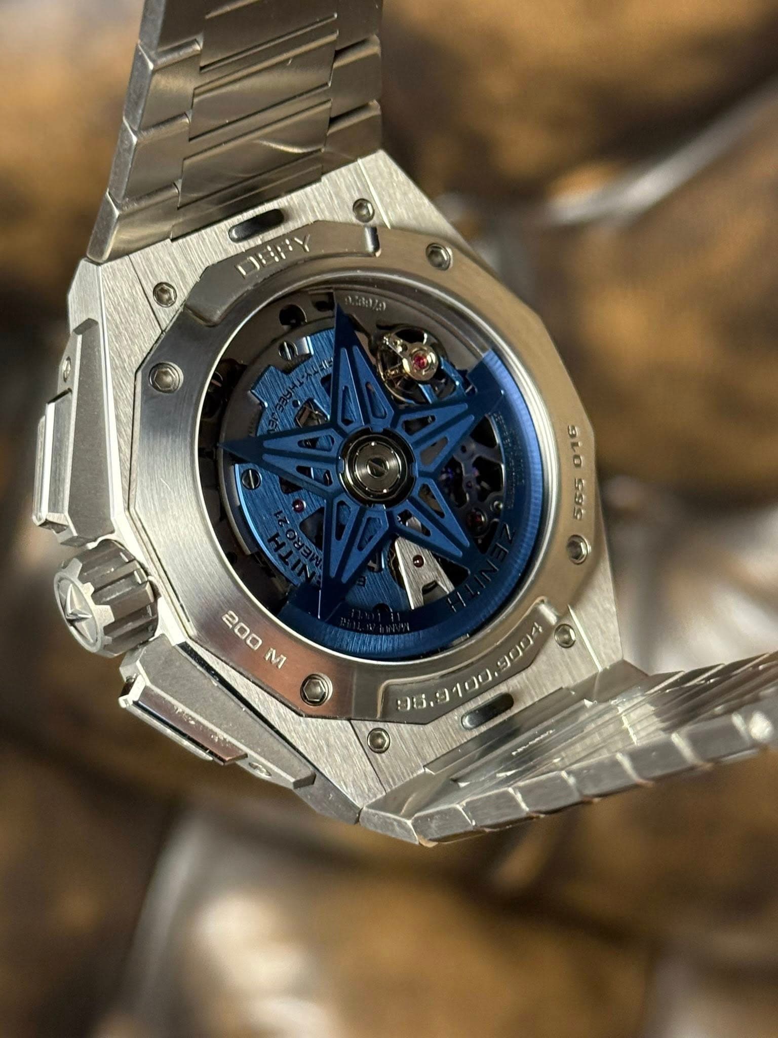 May be an image of wrist watch and text