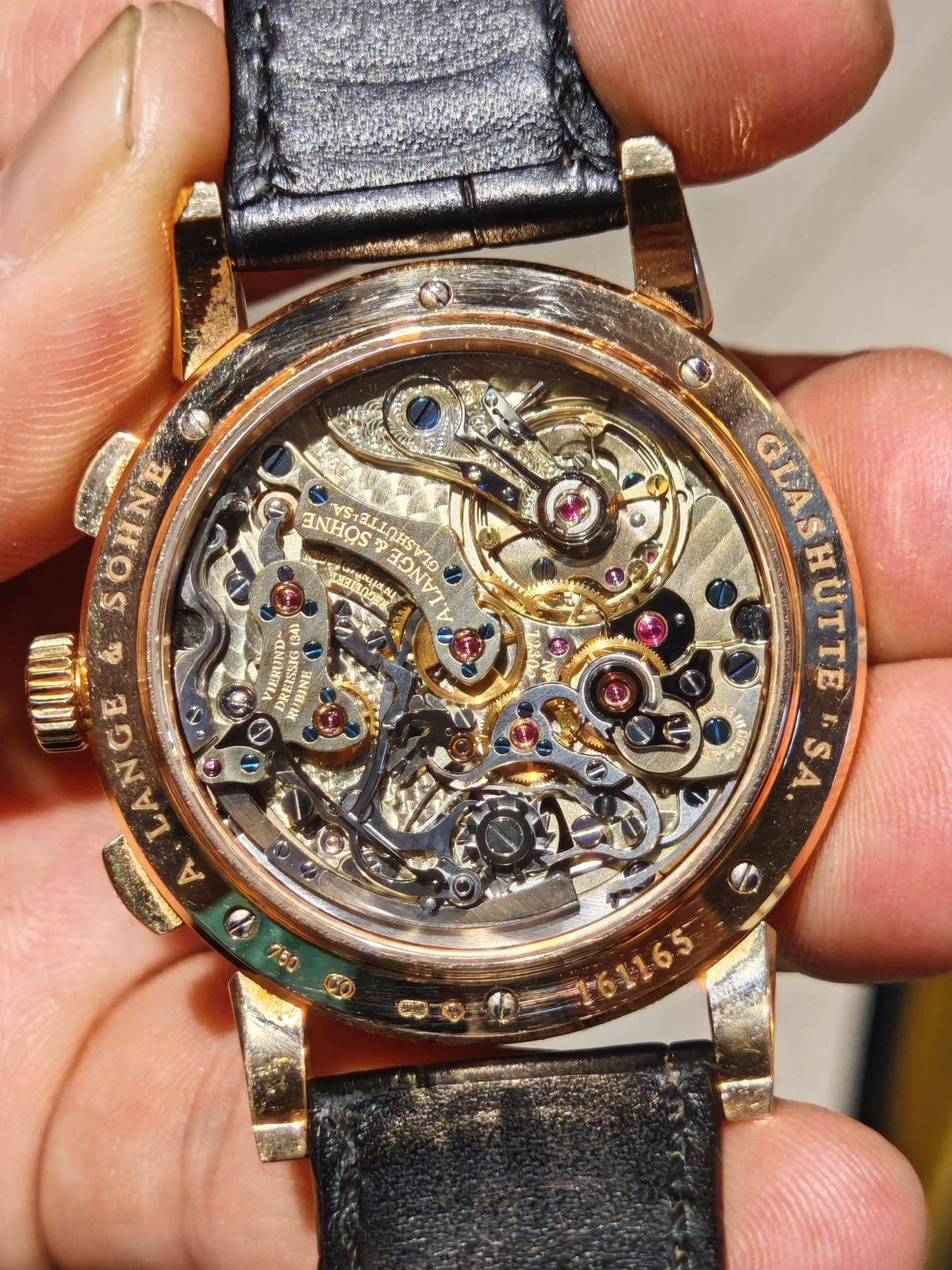 May be an image of wrist watch and text