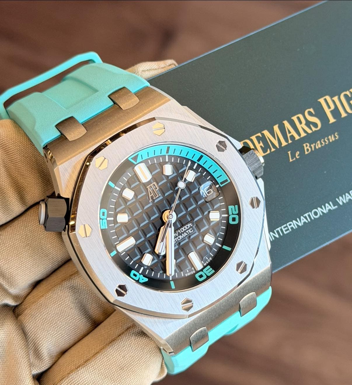 May be an image of wrist watch and text that says 'EMARS Brassus Brassus PIr Le م 50 20 TRMATC /1000 /1000 TOMATIC 食T花 TUMA INTERNATIONAL WA MADE ADE ก SWS DV ي'