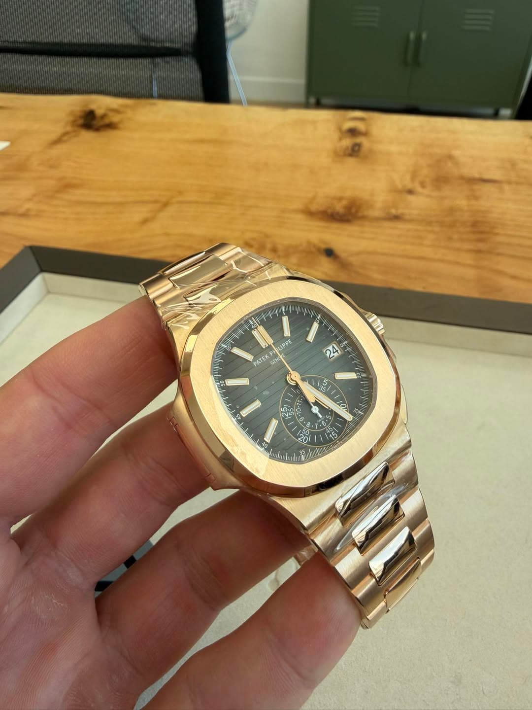 May be an image of wrist watch and text