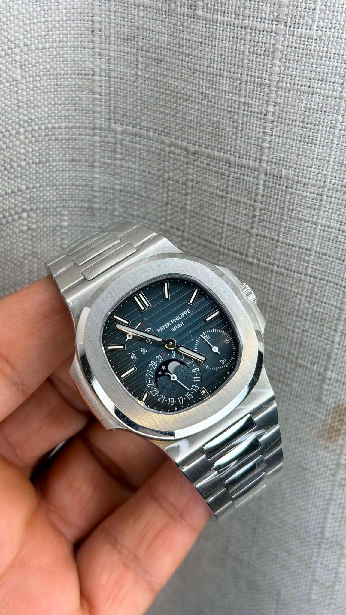 May be an image of wrist watch and text