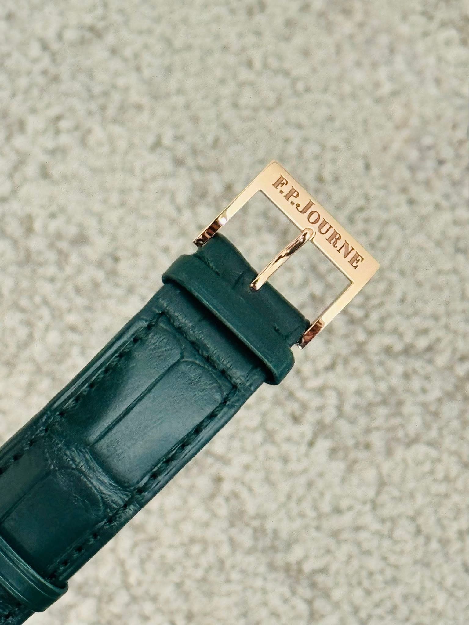 May be an image of wrist watch and saddle-stitched leather