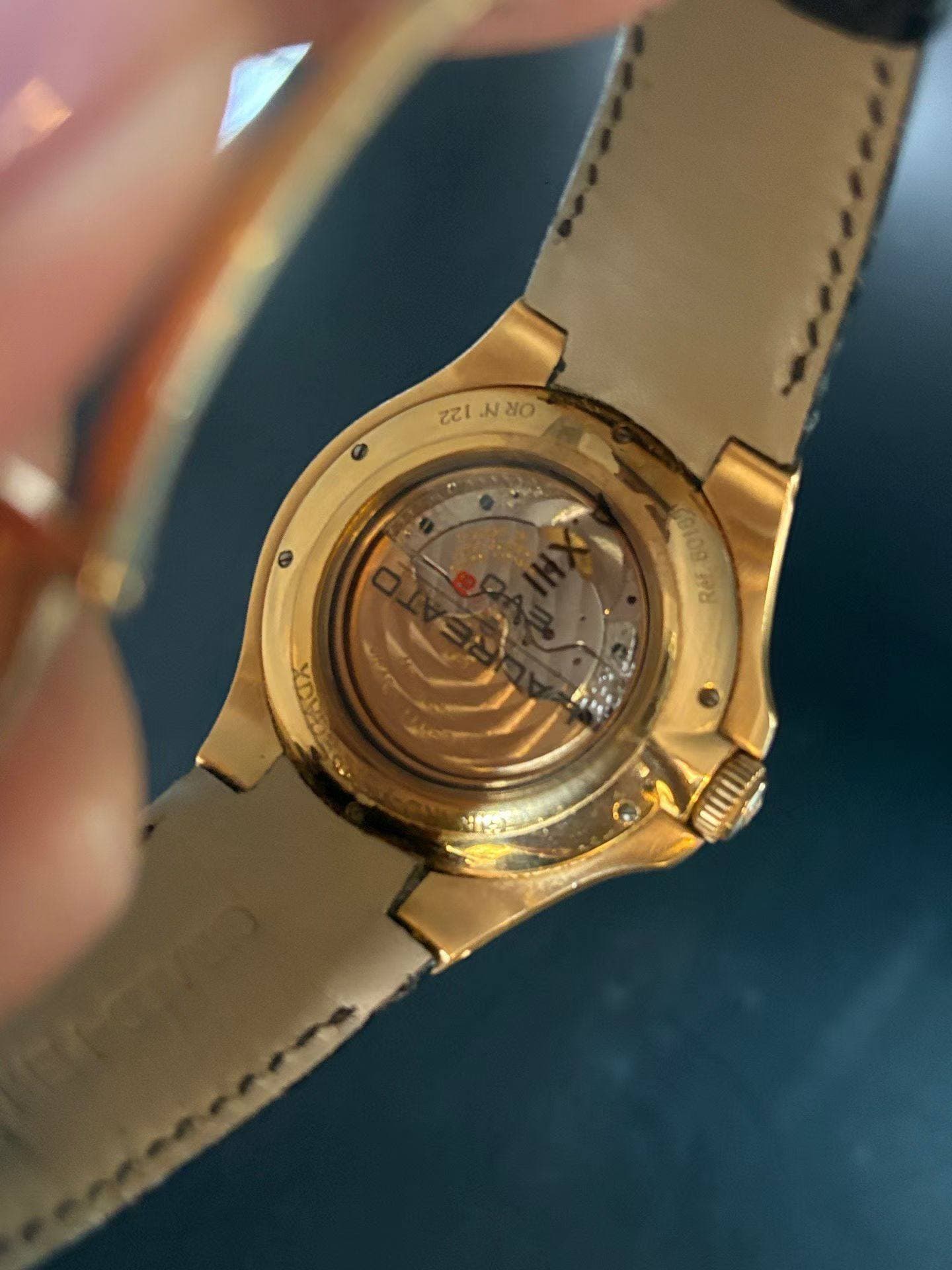 May be an image of wrist watch and text