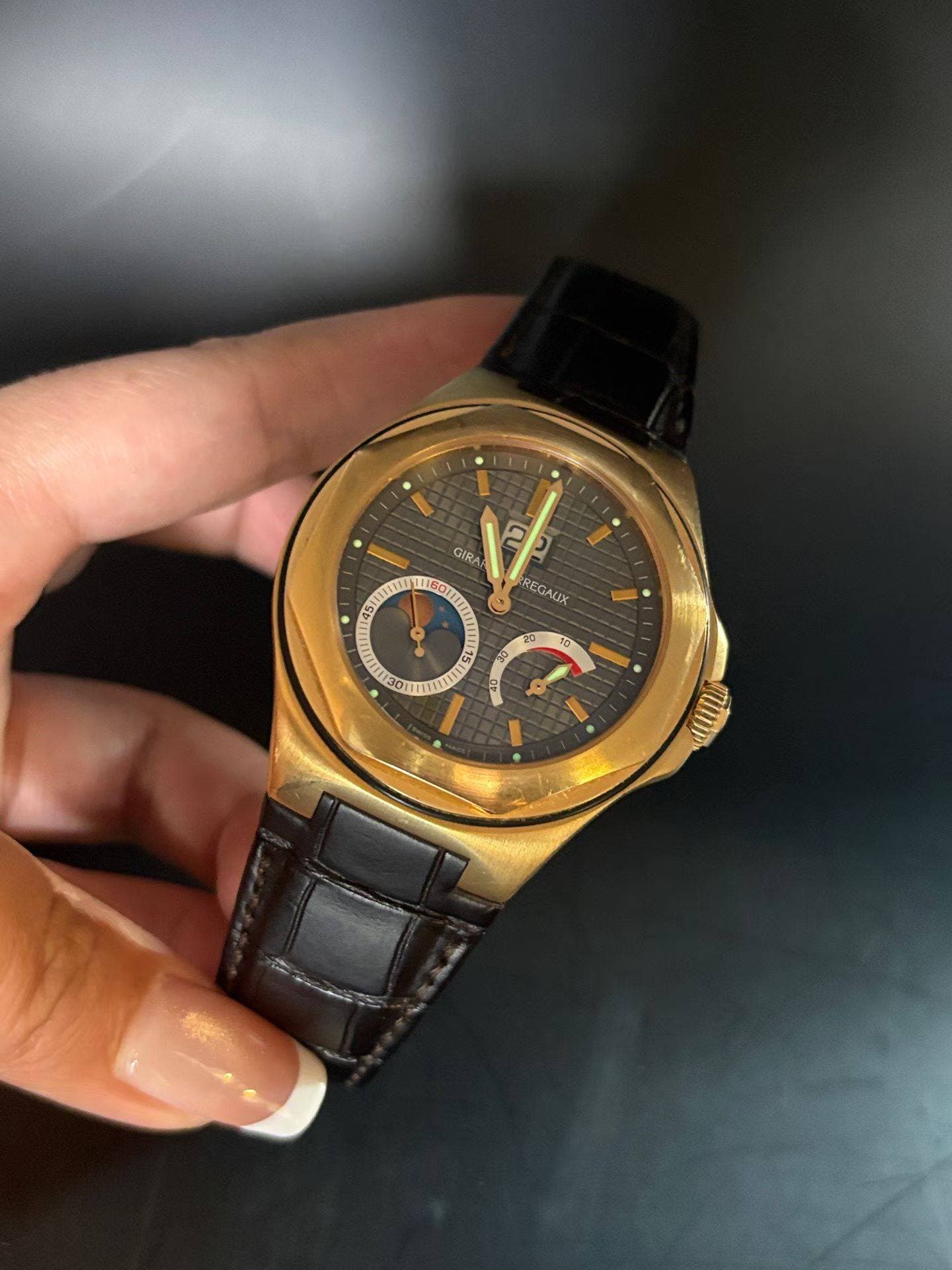 May be an image of wrist watch and text