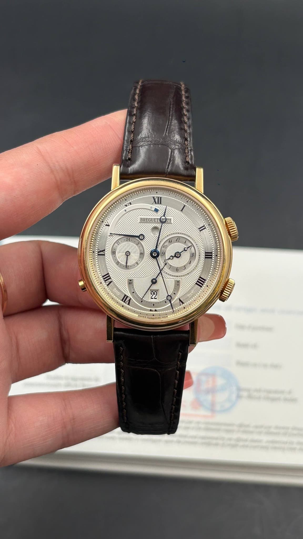 May be an image of wrist watch and text