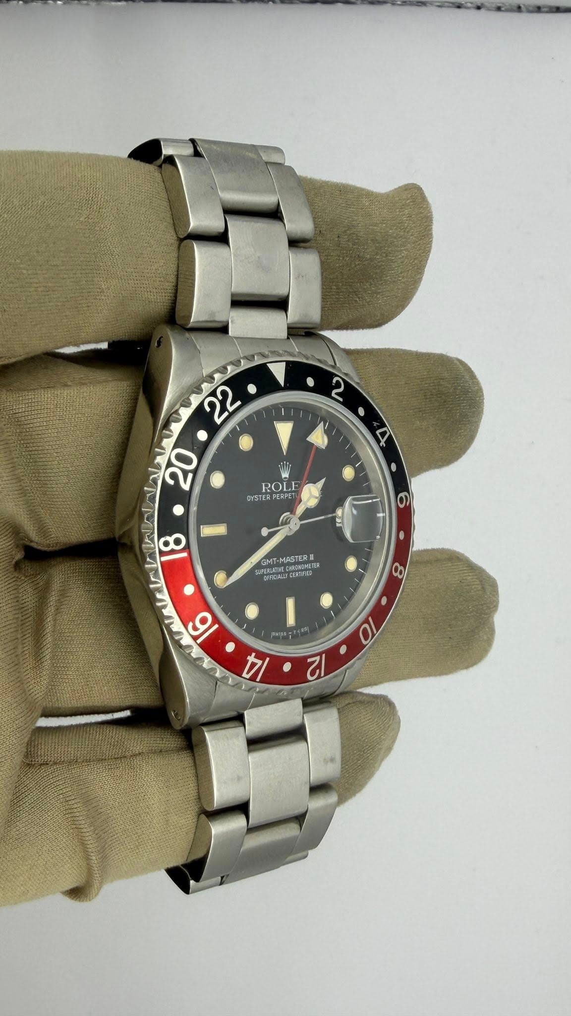 May be an image of wrist watch and text
