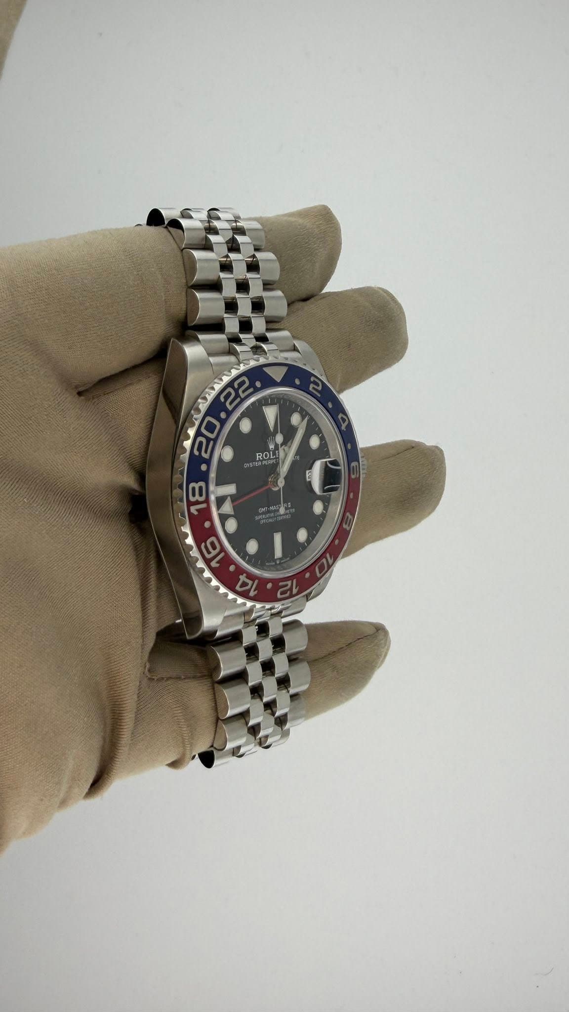 May be an image of wrist watch and text