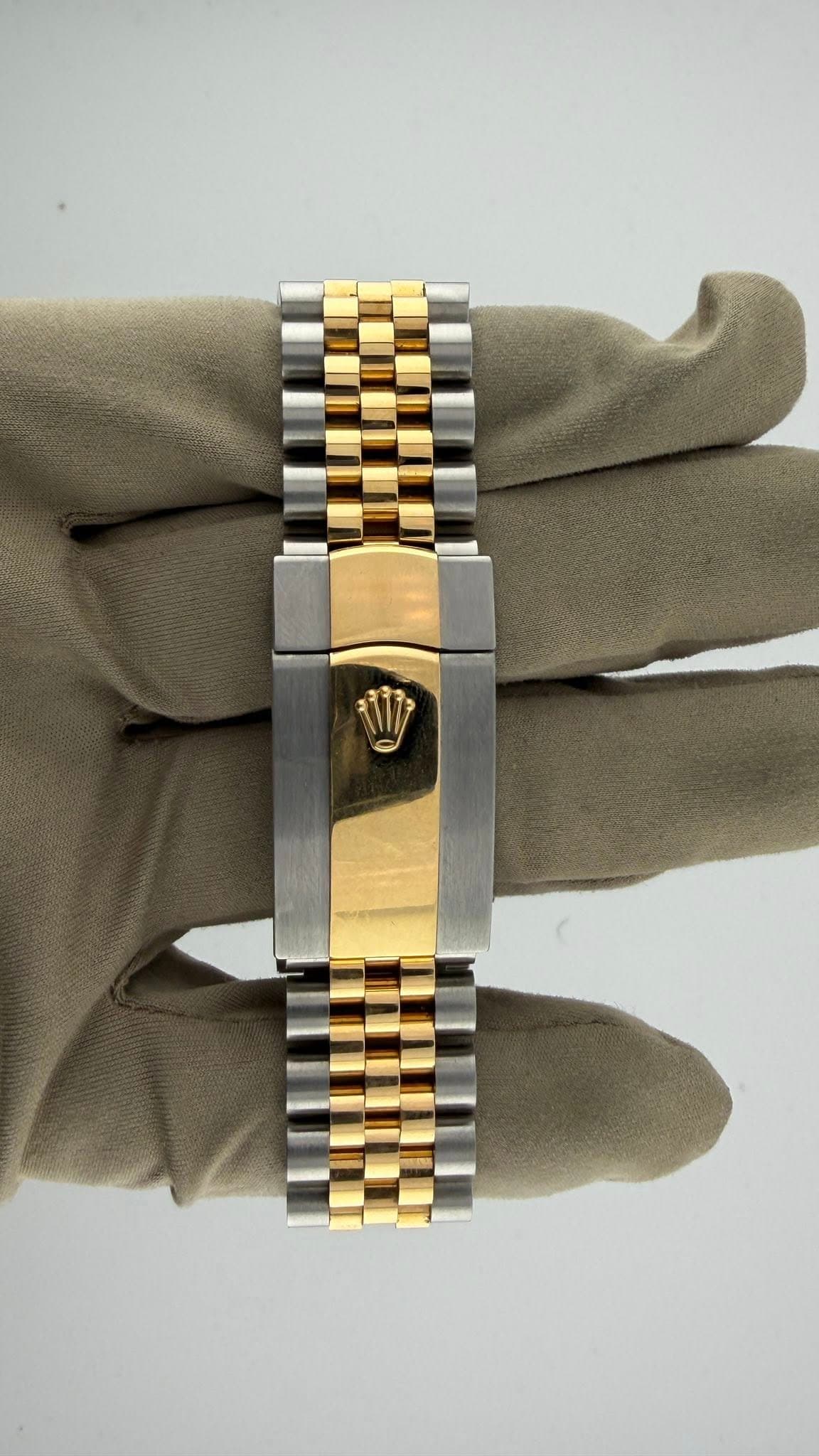 May be an image of wrist watch, brass and jewelry