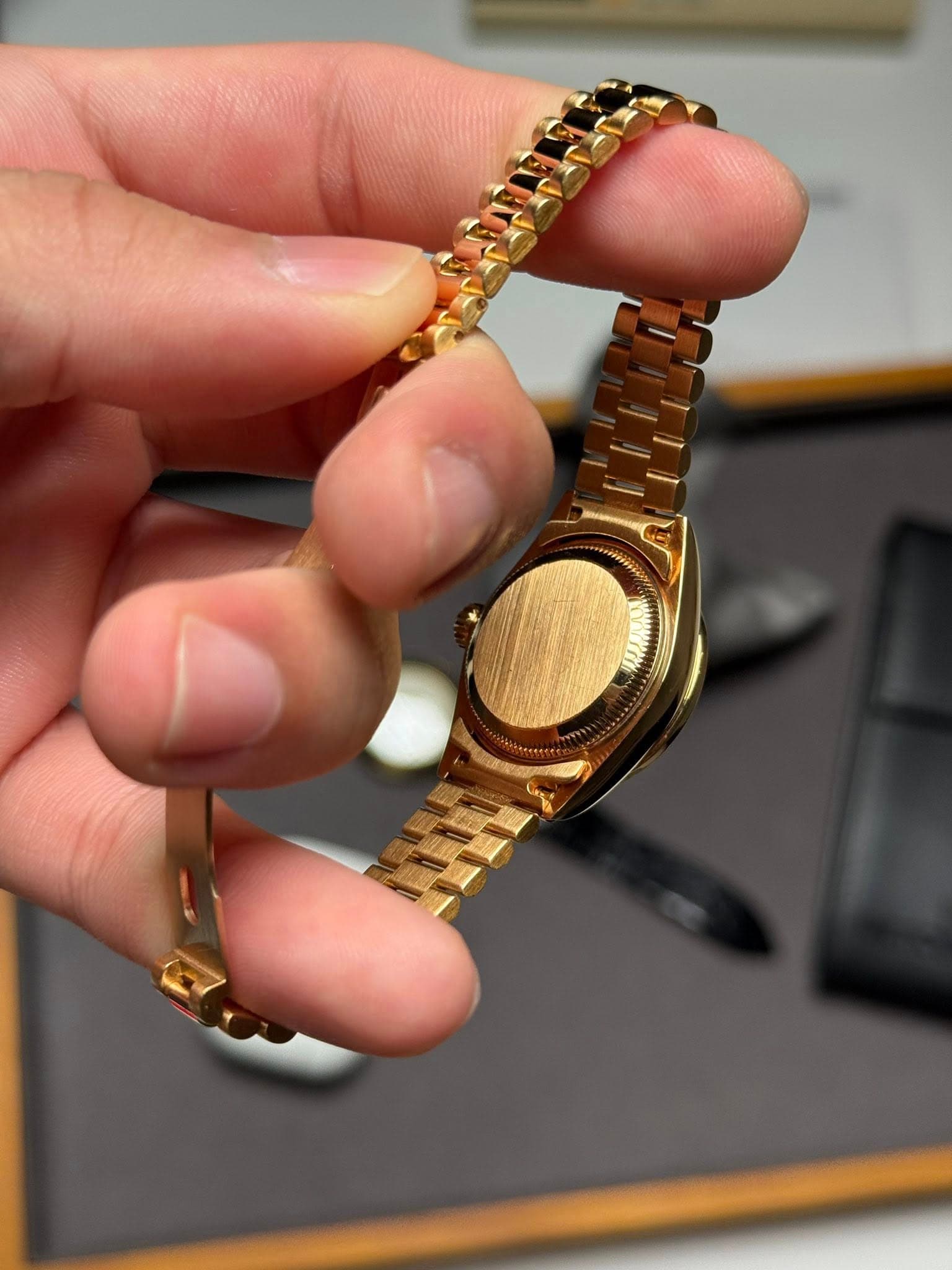 May be an image of wrist watch and text