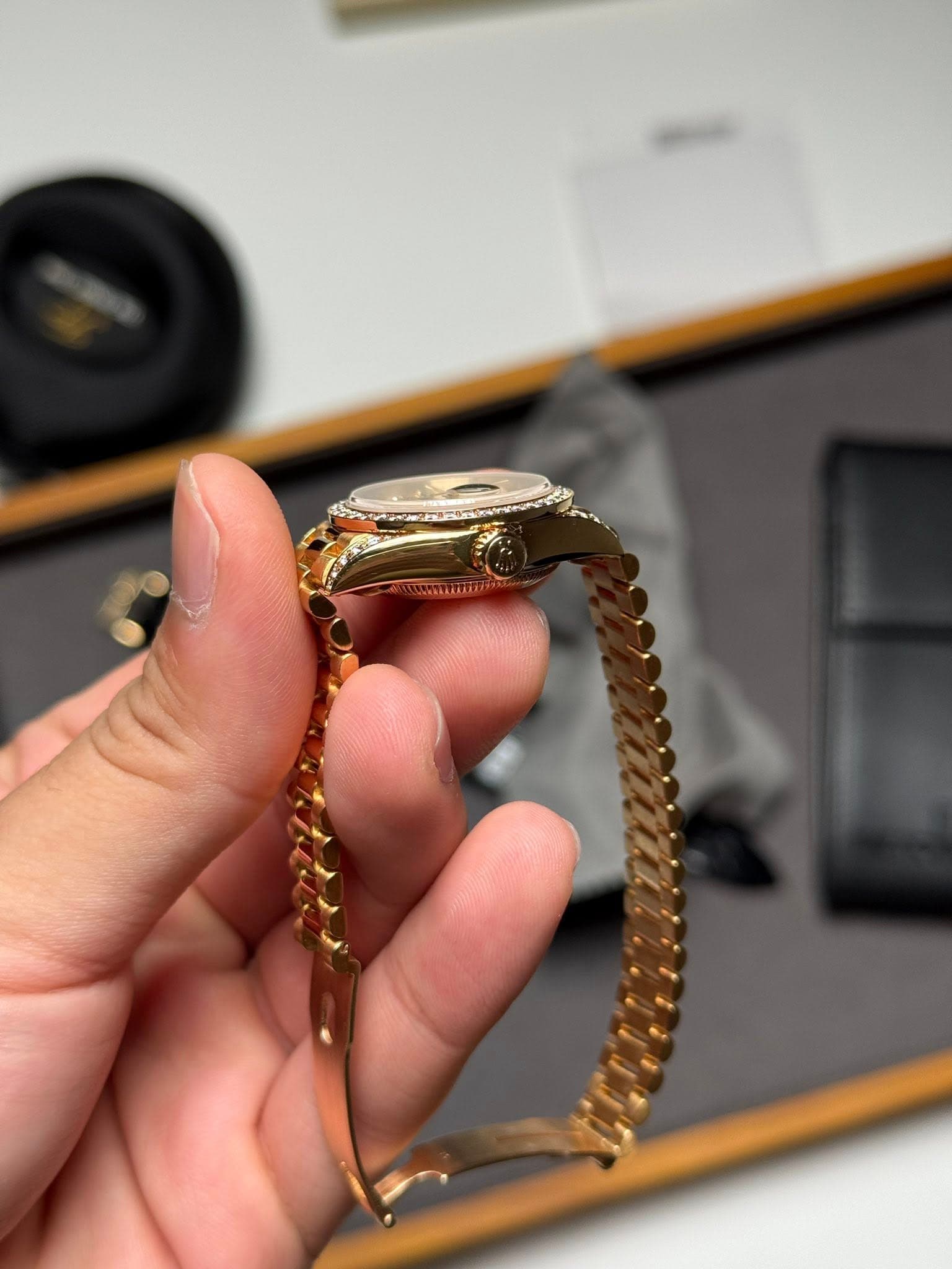 May be an image of wrist watch and jewelry