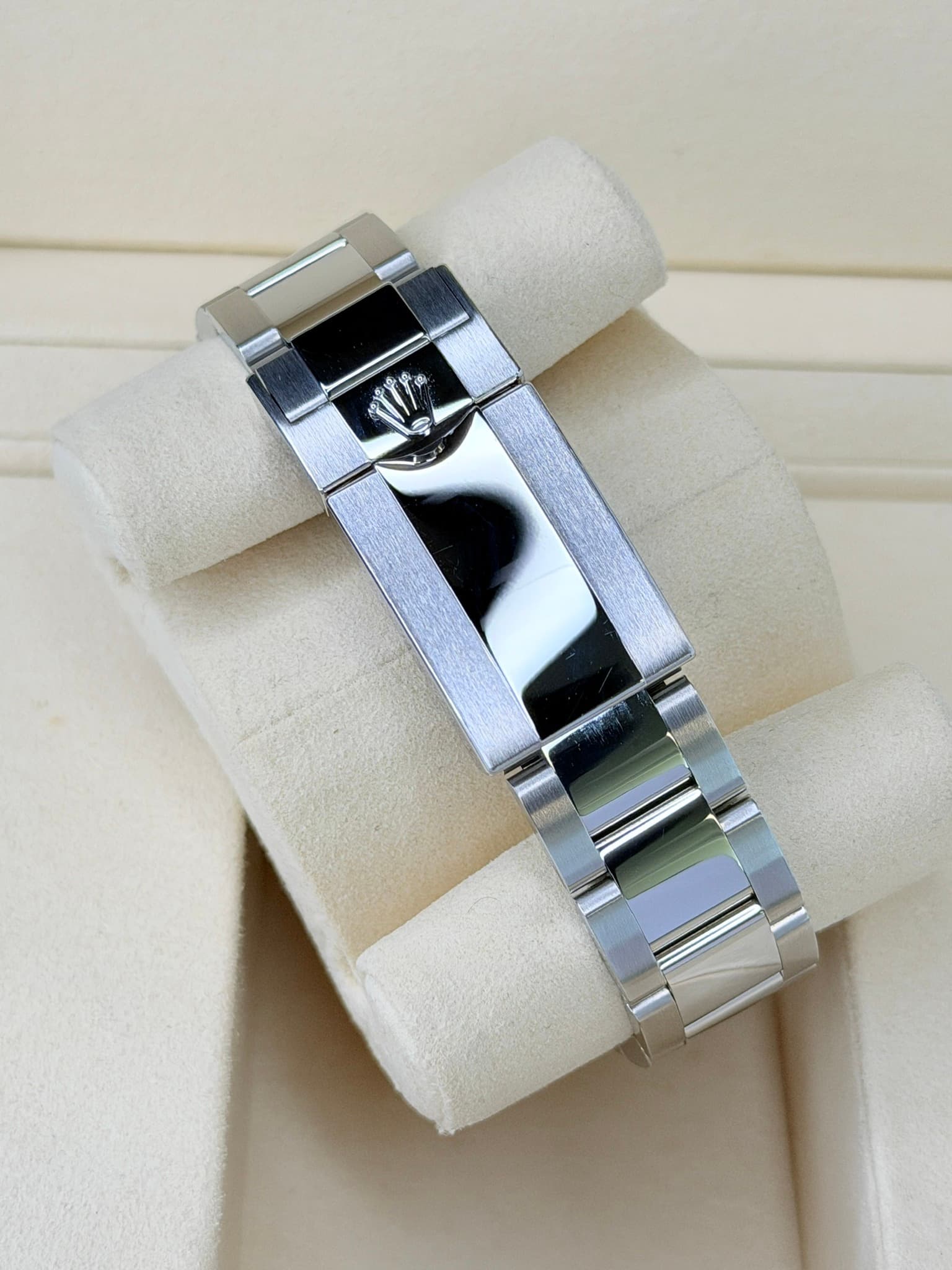 May be an image of jewelry, wrist watch and text