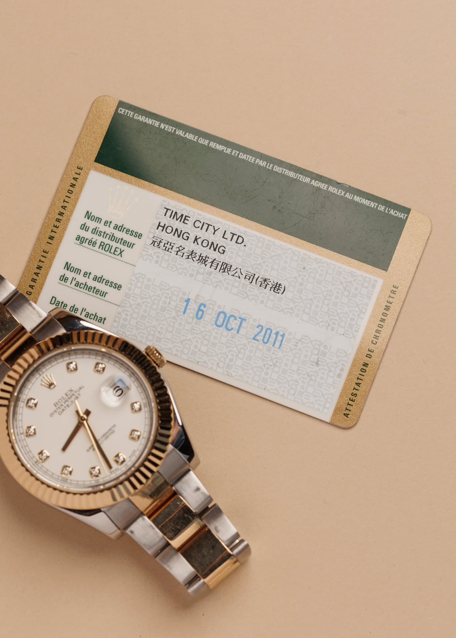 May be an image of wrist watch, money and text that says 'CETTE GARANTIE EST VALABLE QUE REMPLIE DATEE PARLE DISTRIBUTEUR AGREE ROLEX UMOMENT DE ACHAT Nom et adresse HONG TIME KONG…