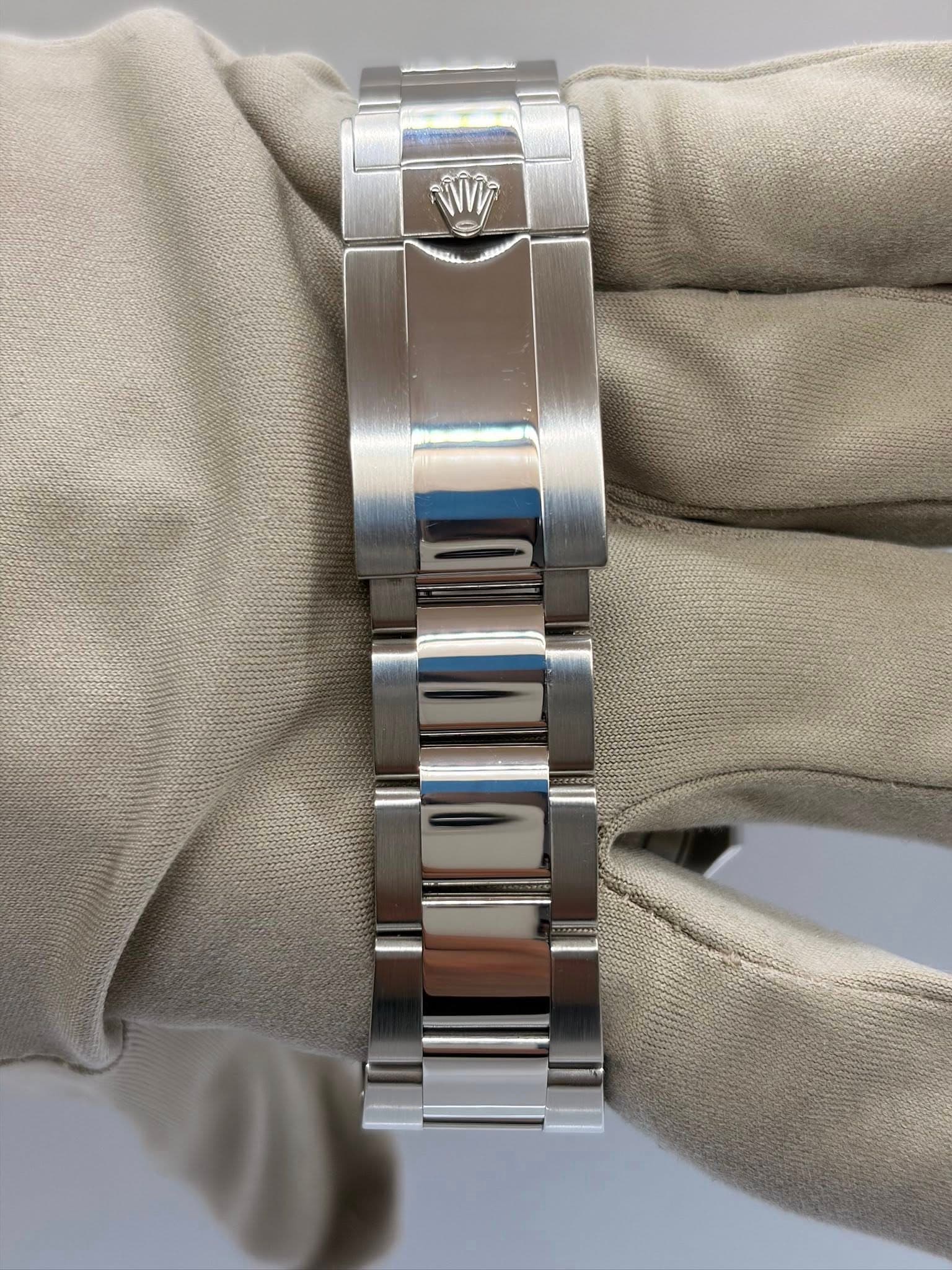 May be an image of jewelry, wrist watch and text