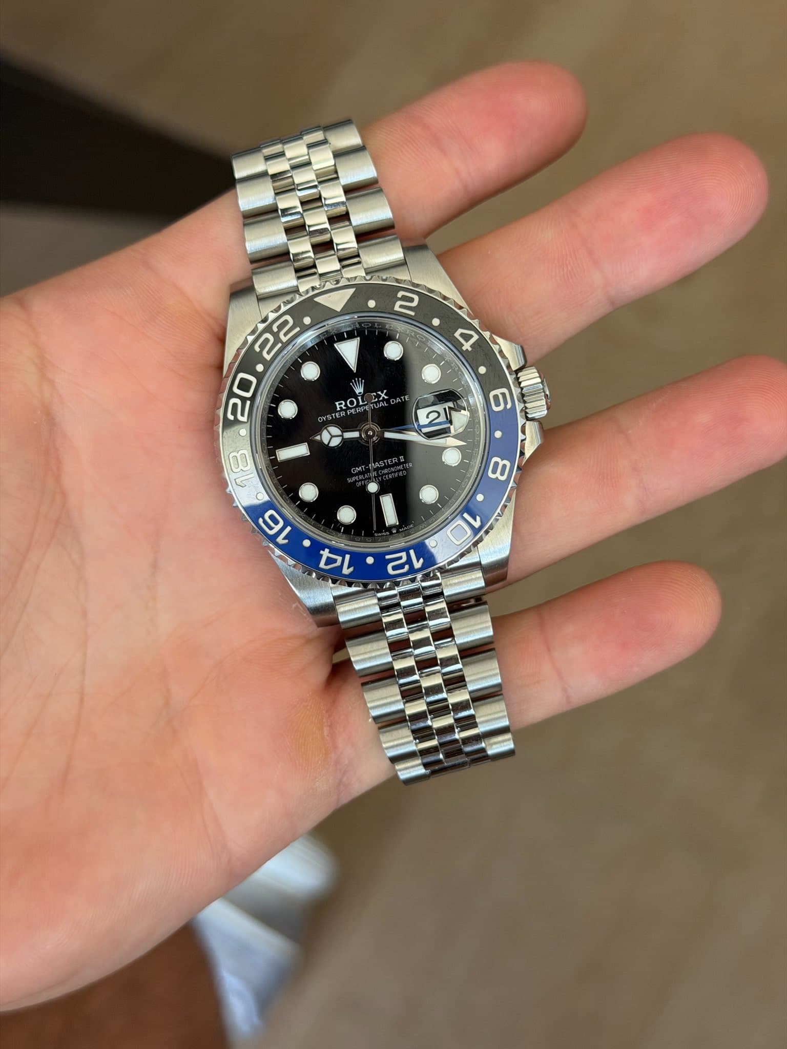 May be an image of wrist watch and text