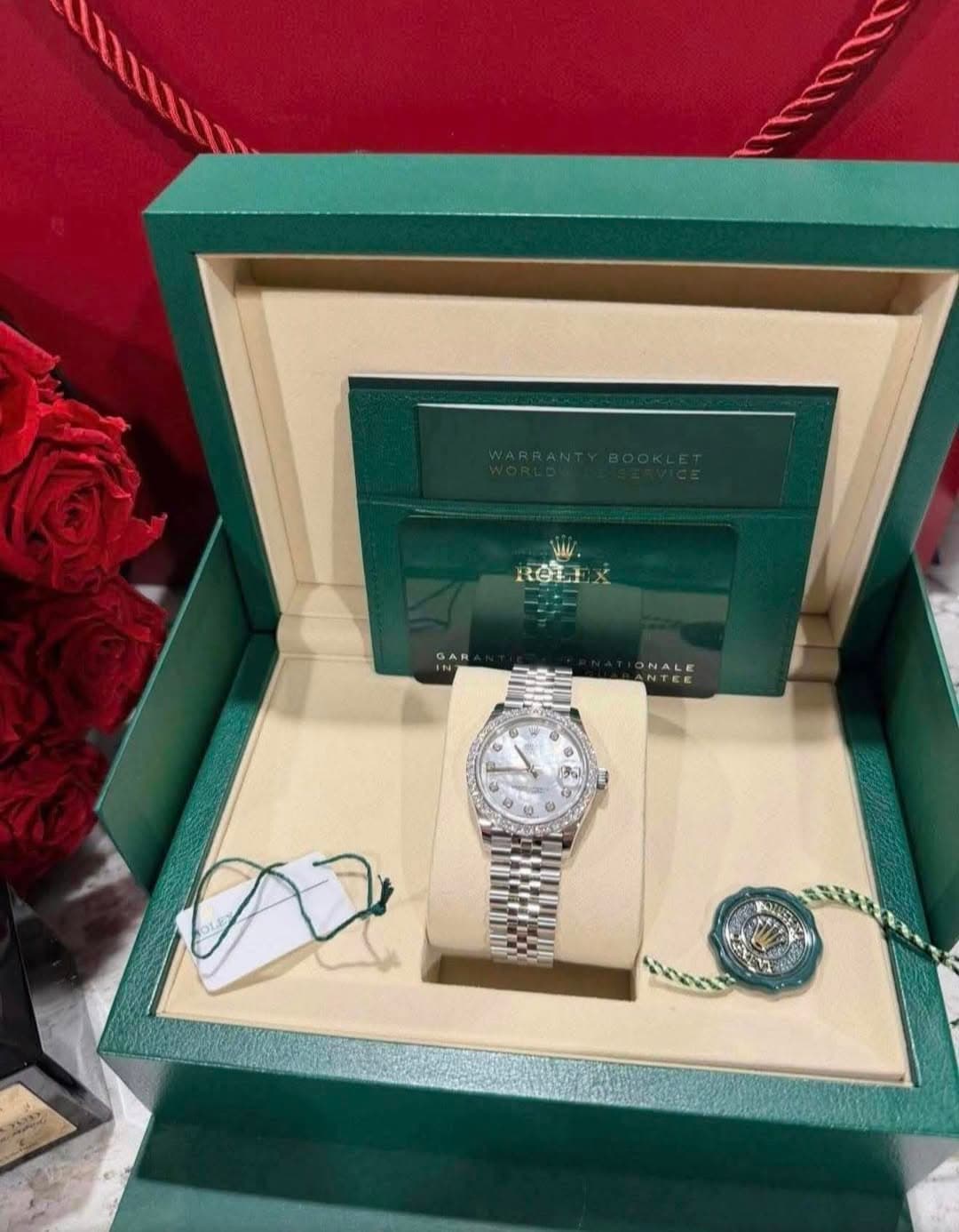 May be an image of wrist watch and text
