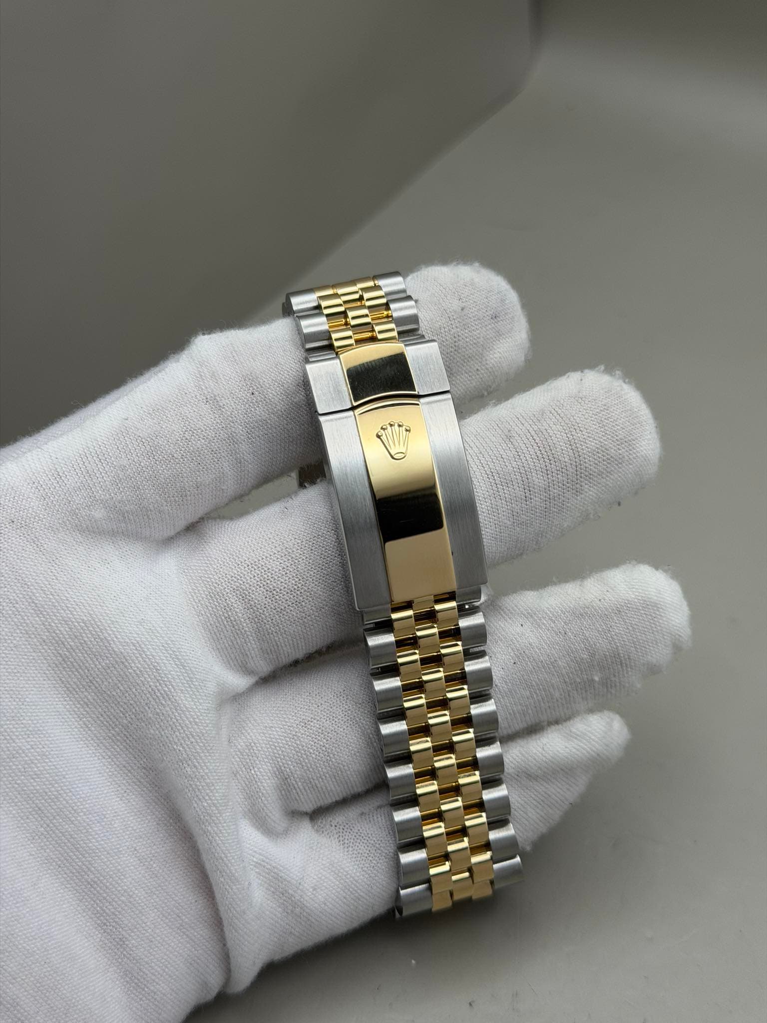 May be an image of wrist watch and jewelry