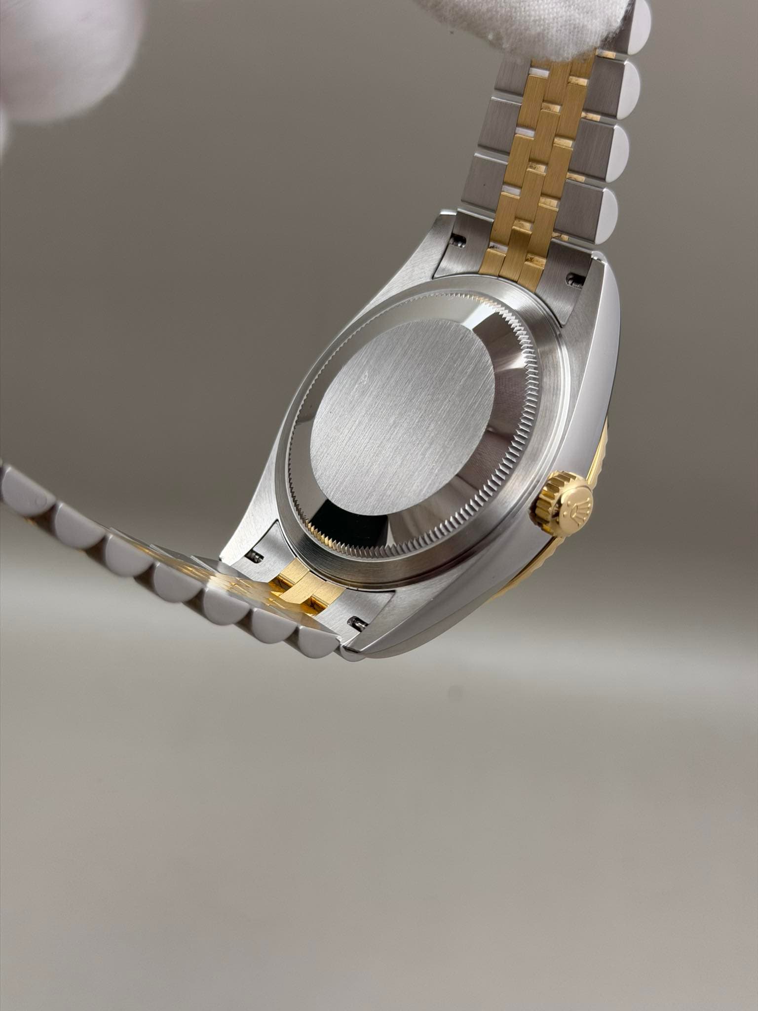 May be an image of wrist watch and text