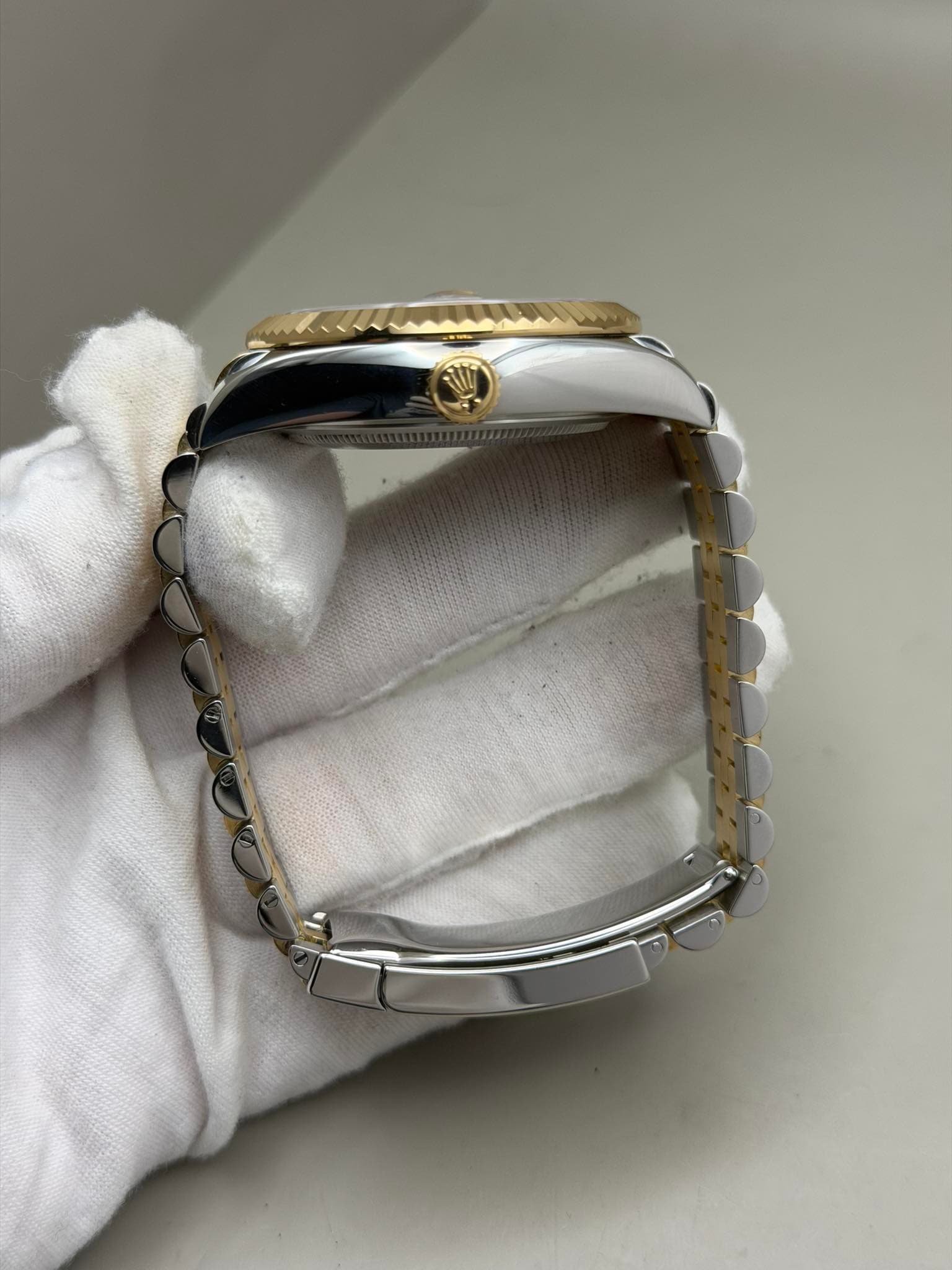 May be an image of jewelry and wrist watch